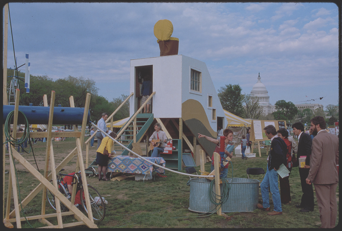 Festivalgoers check out a compost toilet exhibition at Earth Day activities held in Washington, DC in 1980