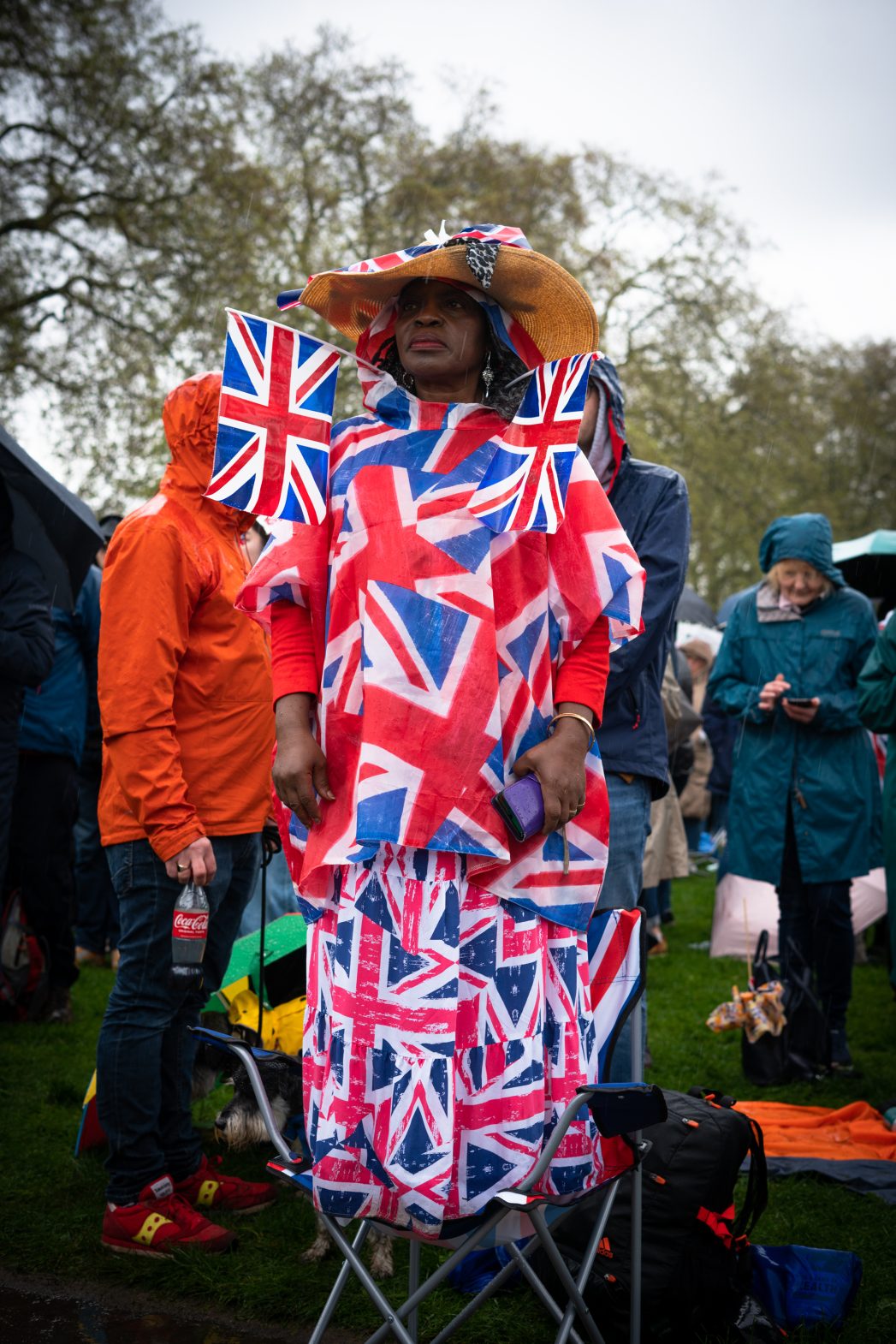 A reveller wearing a dress made from small Union Jack flags