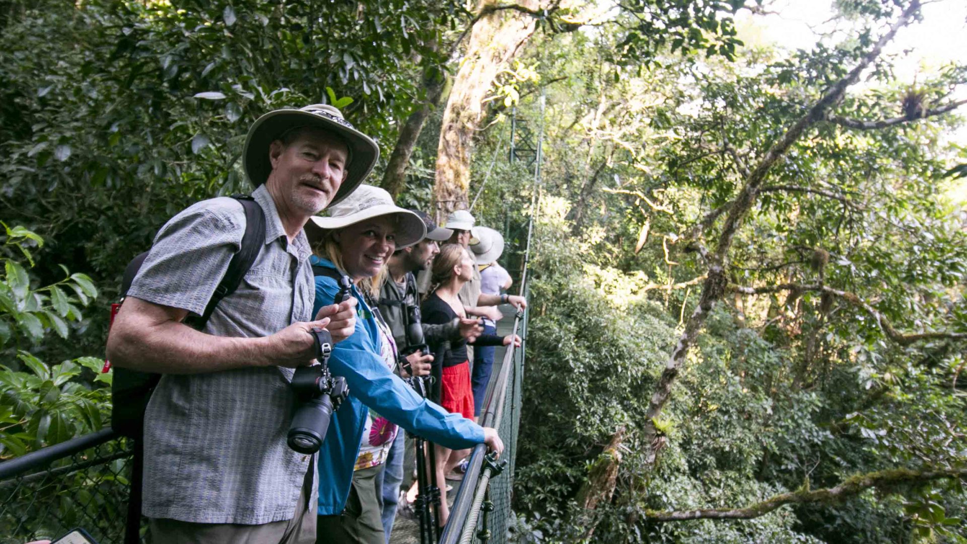 A group of travelers on a hanging bridge in Monteverde.