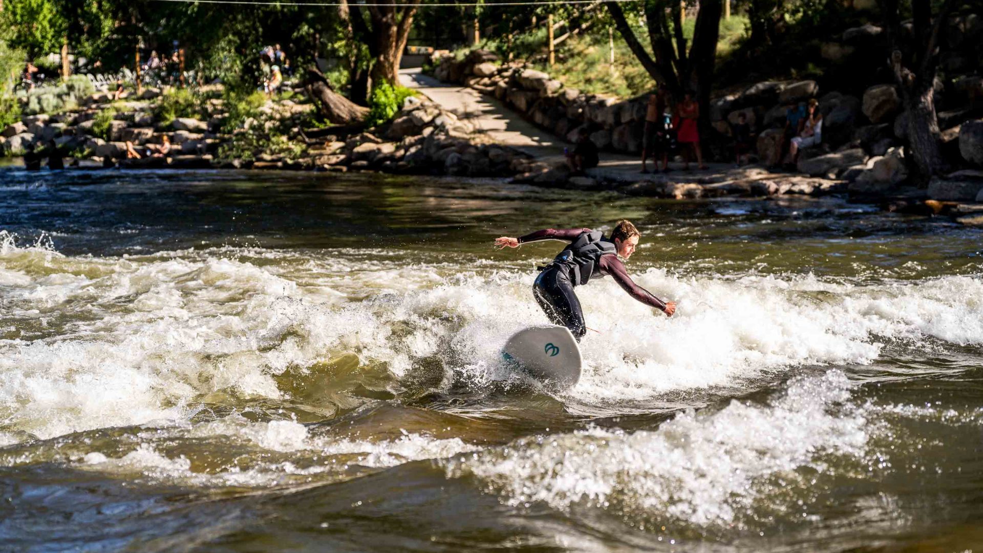 A man surfing on the river.