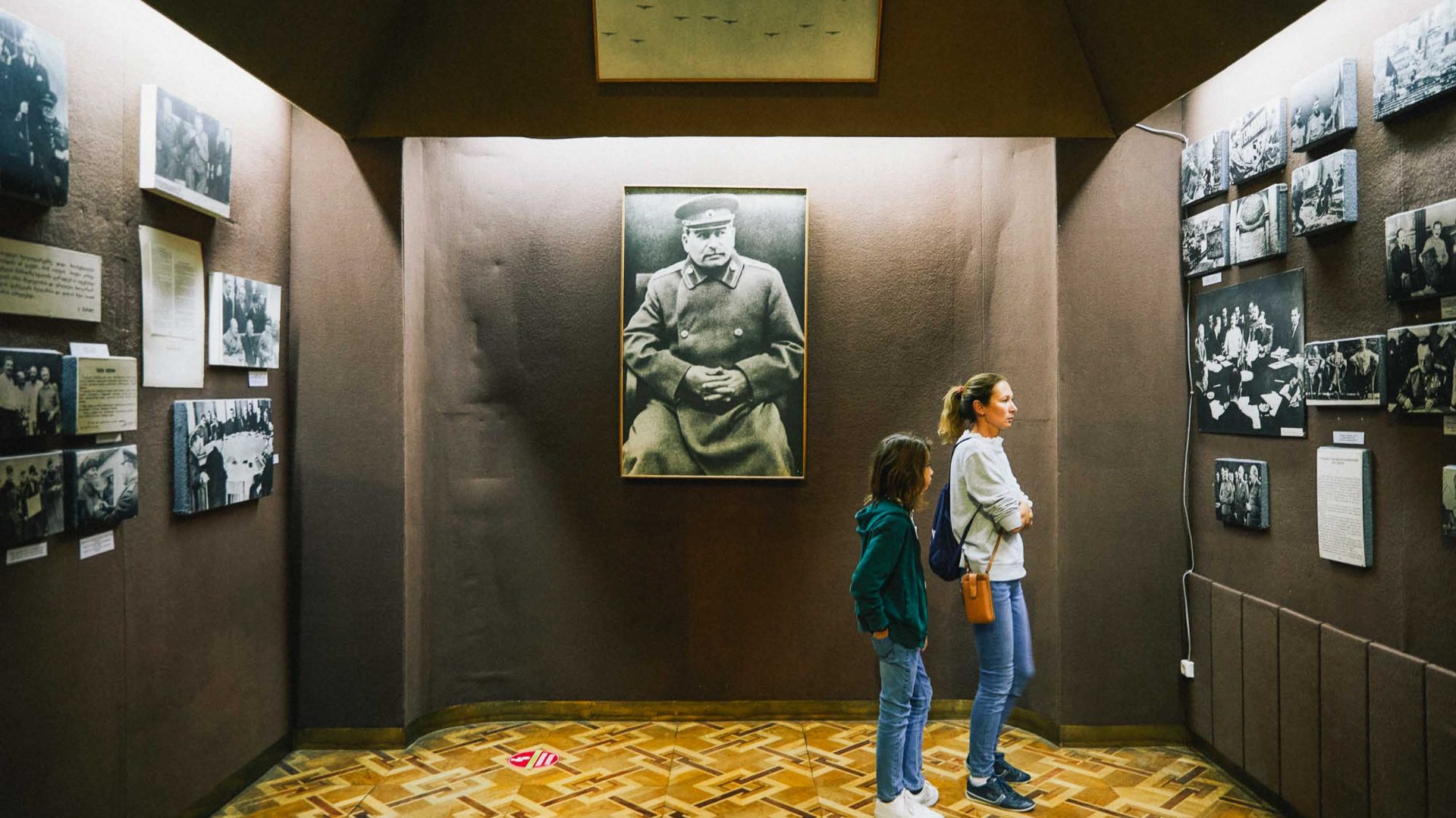 People look at the exhibition in the Stalin museum.