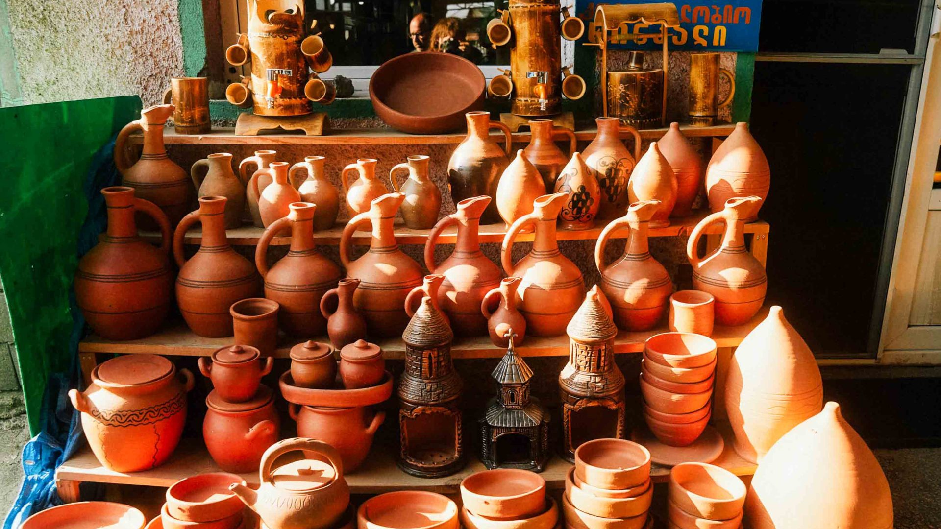 A market display of clay jugs.