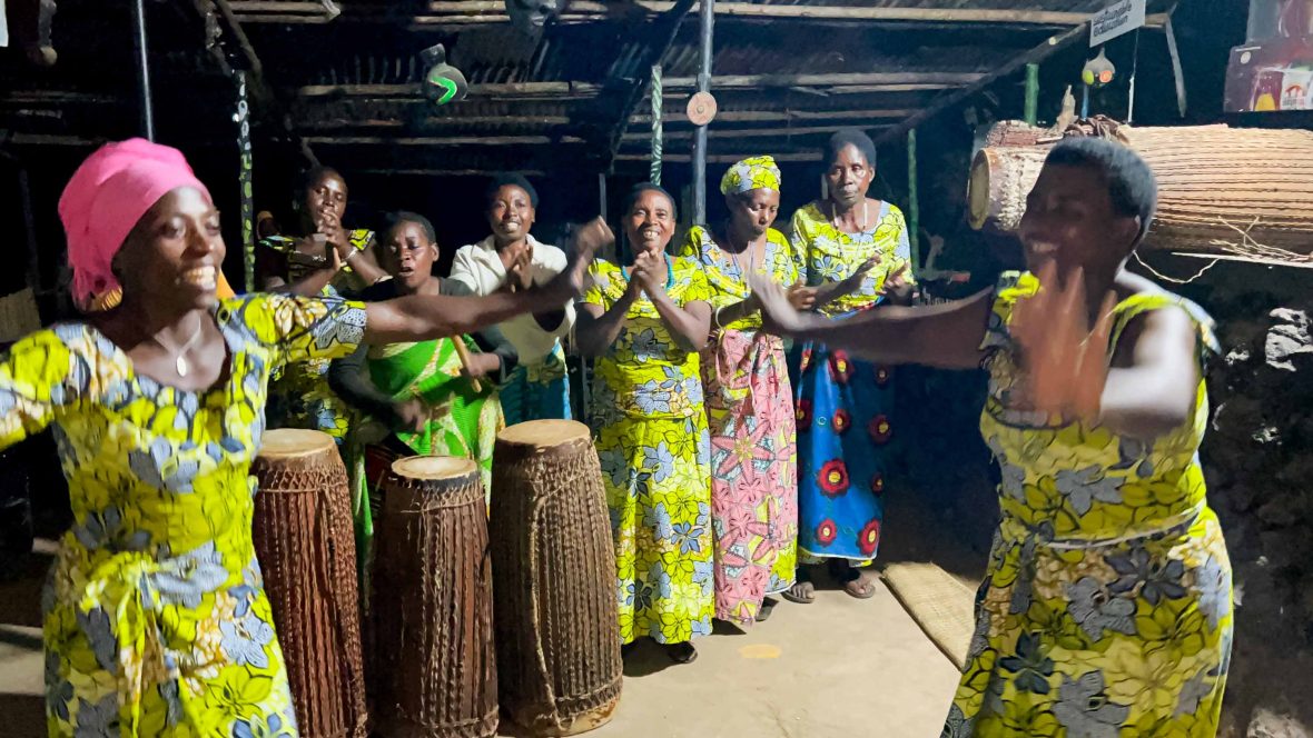 Women clap, dance and play drums.