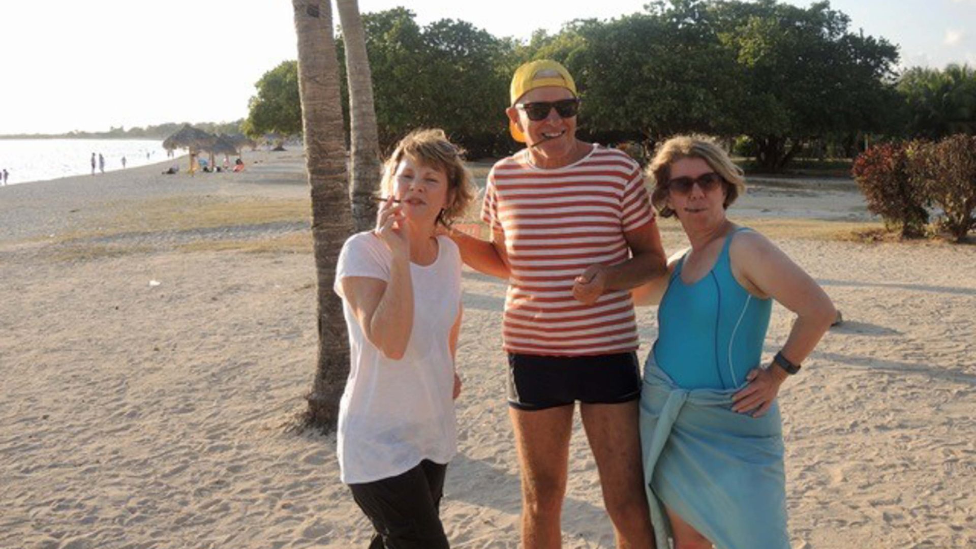 Jan, Sharon and another friend smile on a beach in Cuba.