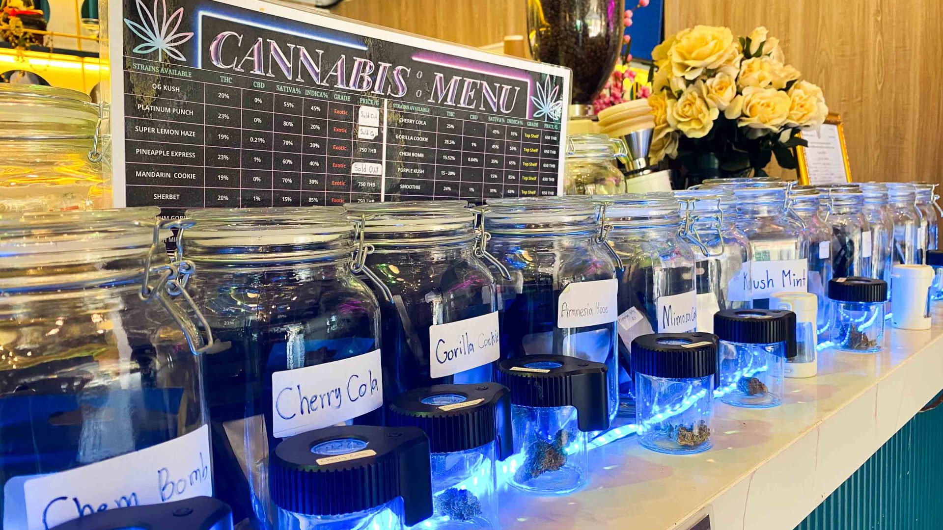 An assortment of jars holding different types of cannabis.