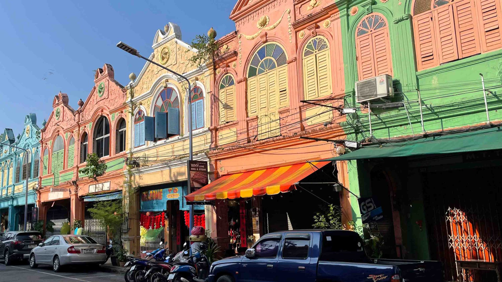 Colourful shops and houses line the street in Hat Yai.