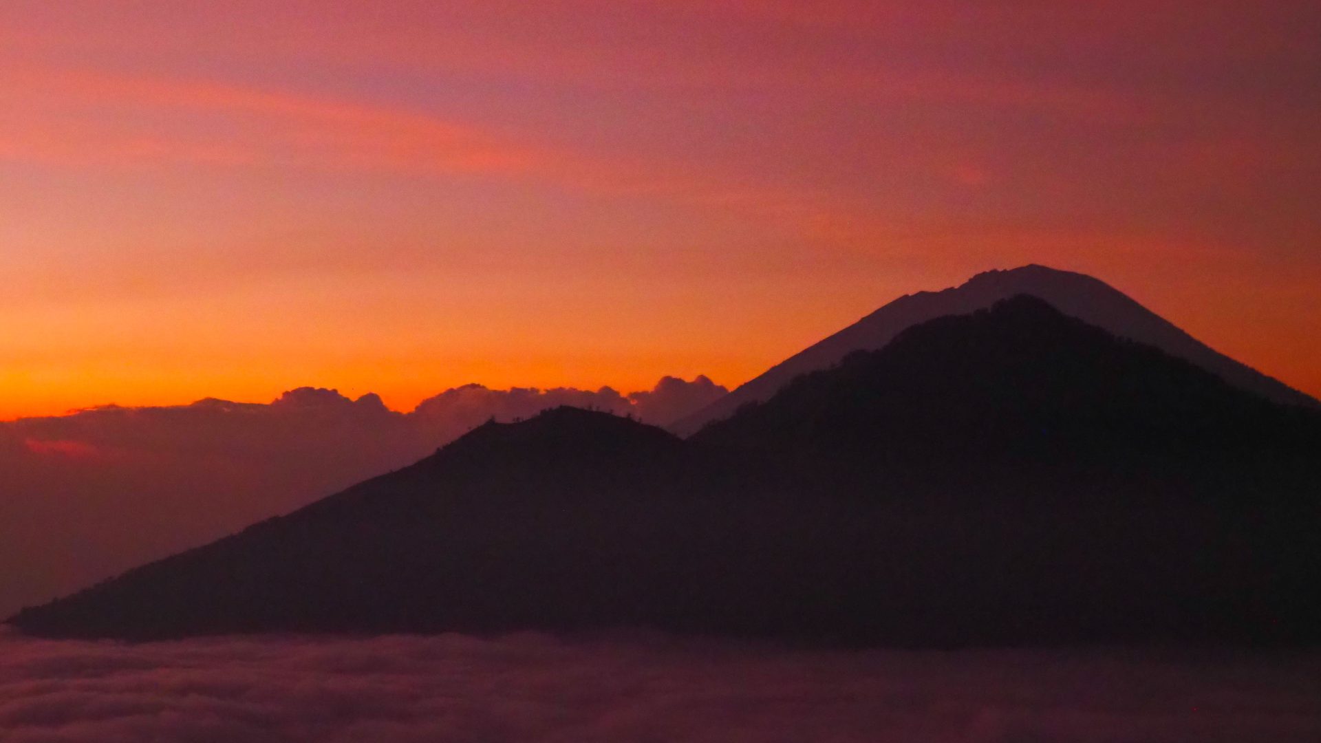 Mt Agung bathed in orange pre dawn light.