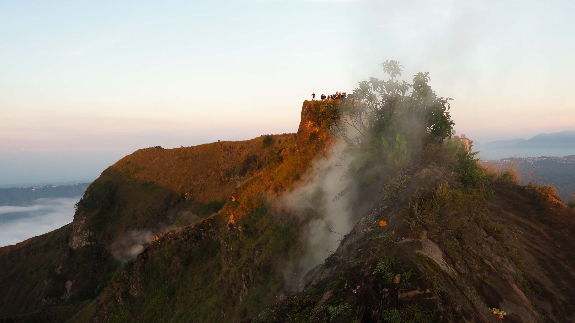 Tourists at a fumerole at the summit of Mt Batur in Bali.
