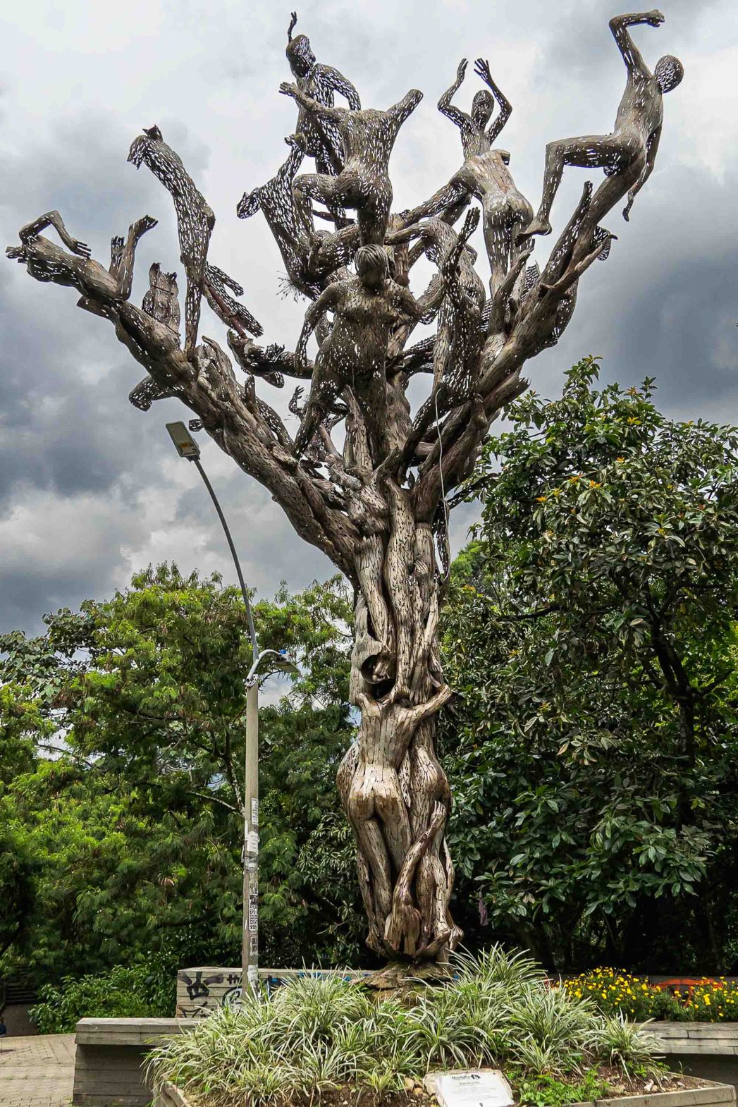 Arbol de la vida or tree of life is a tree statue with a cluster of naked, metallic bodies form the trunk, their limbs entwined.