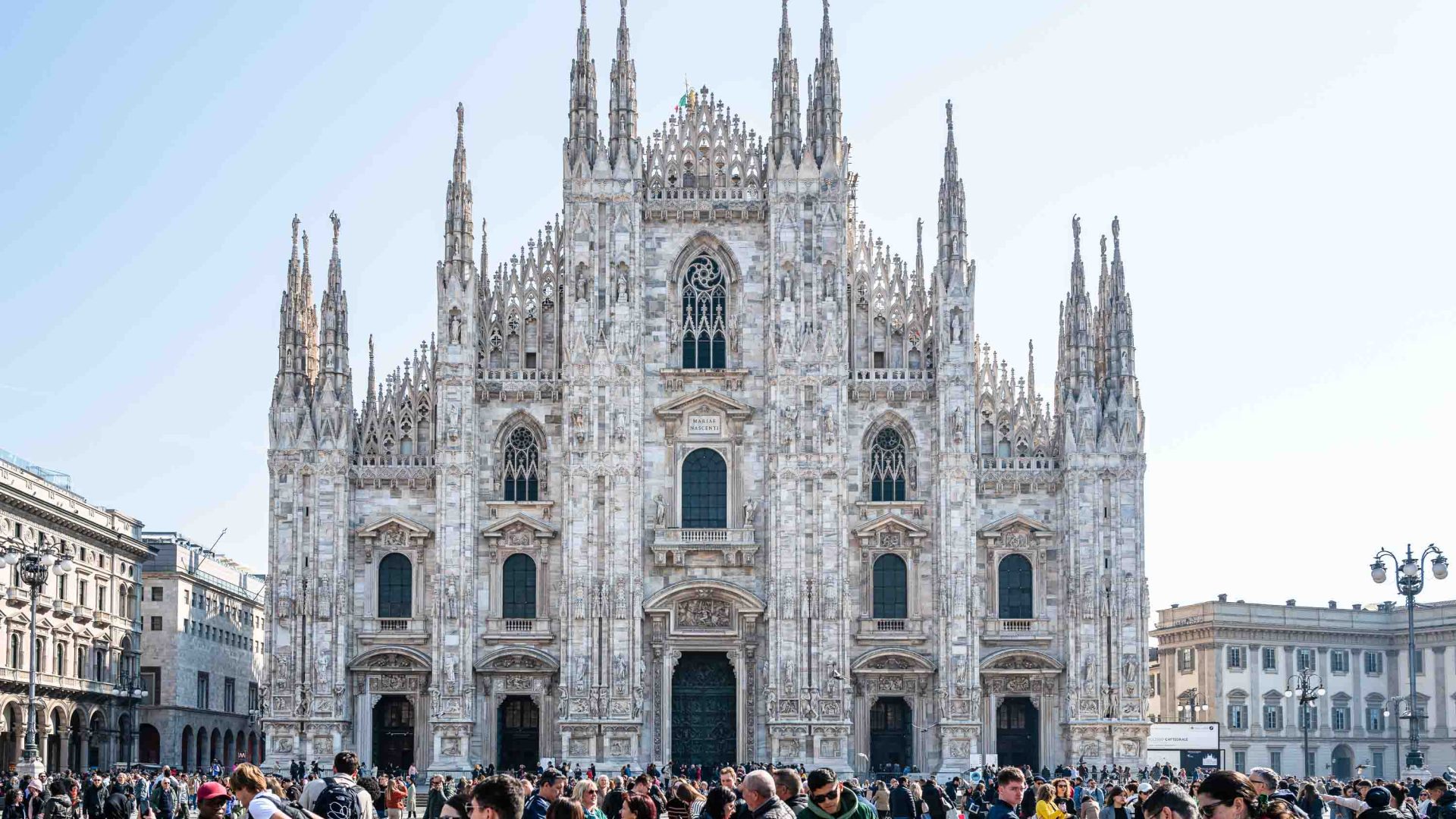 Crowds outside a cathedral in Milan, Italy.