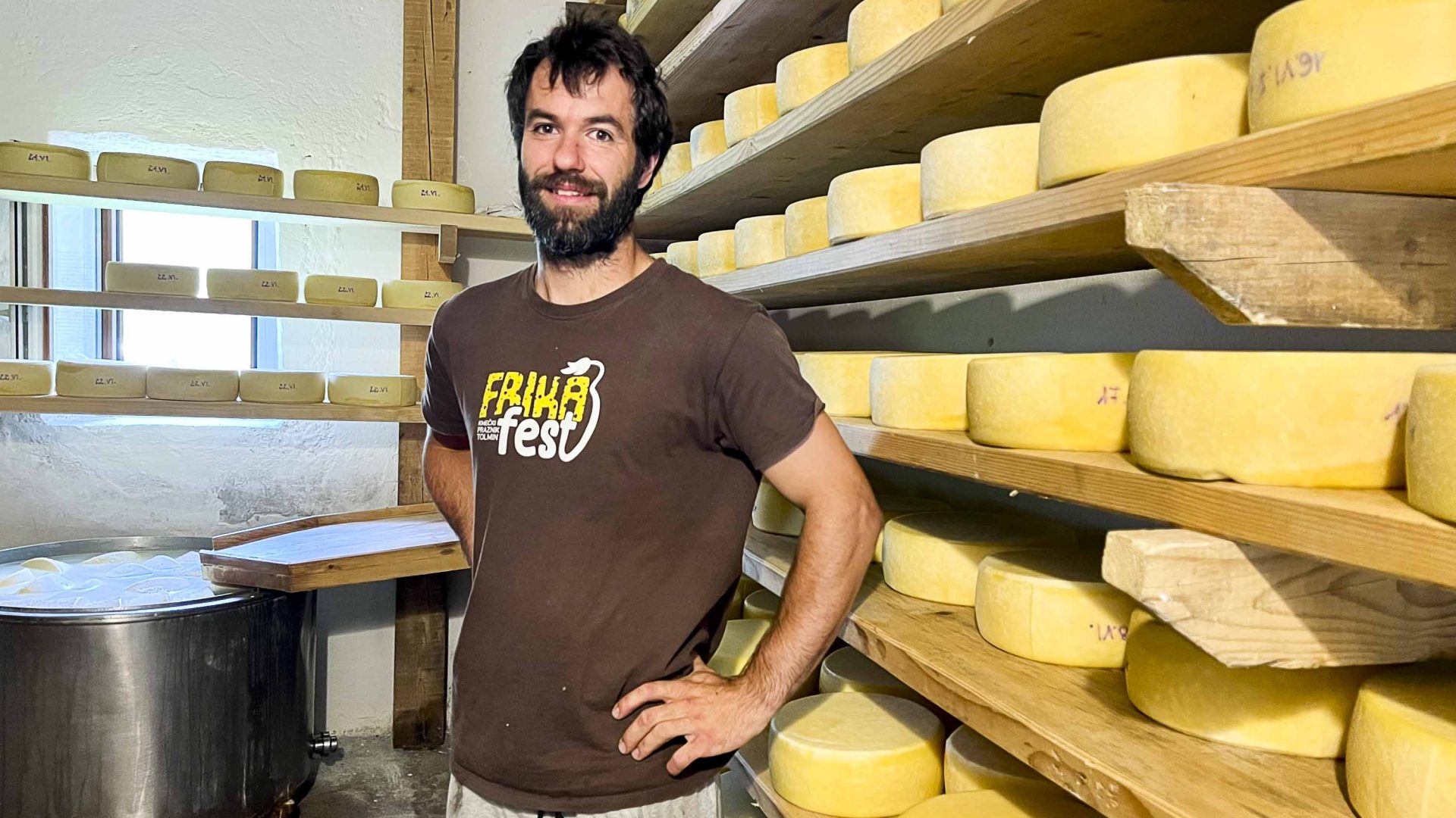 A cheese maker with his cheeses.