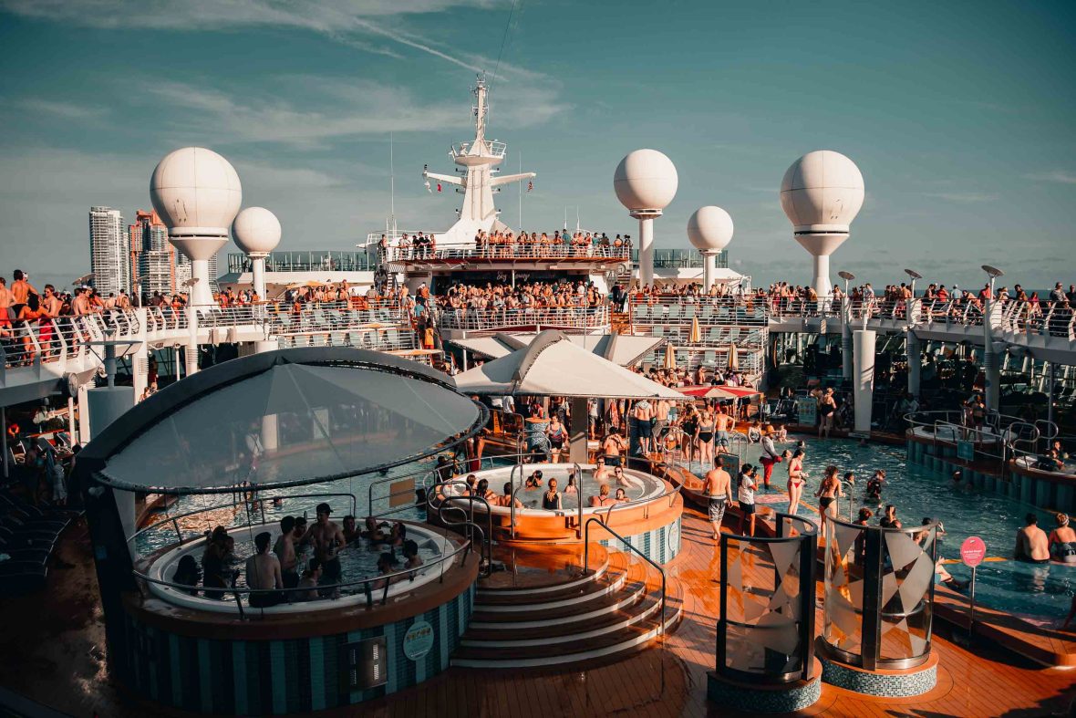 People enjoy the activities on a cruise ship deck.