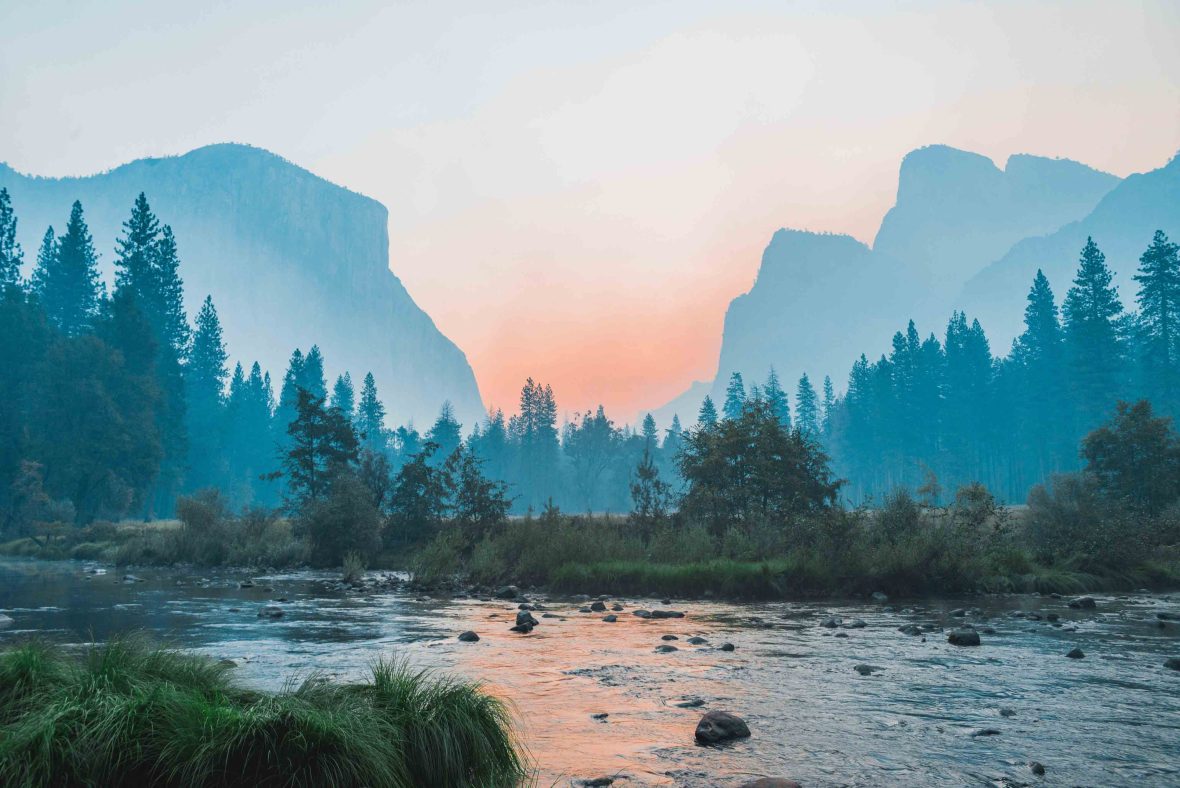 Yosemite National Park, with mountains, sunset and river.