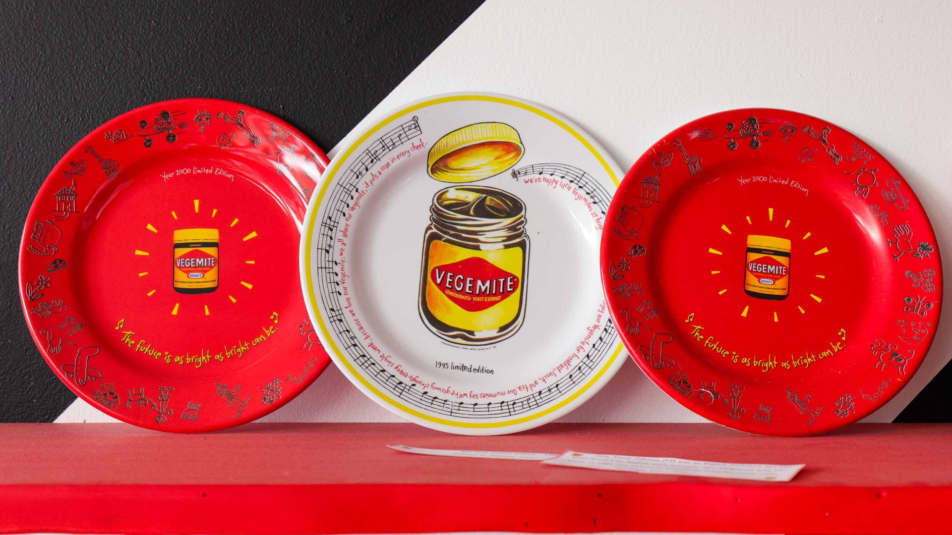 Decorative plates with Vegemite jars on them, on display at the museum.