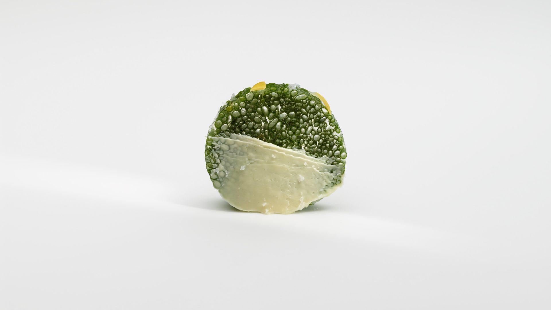 Chives and butter served in an artistic ball.