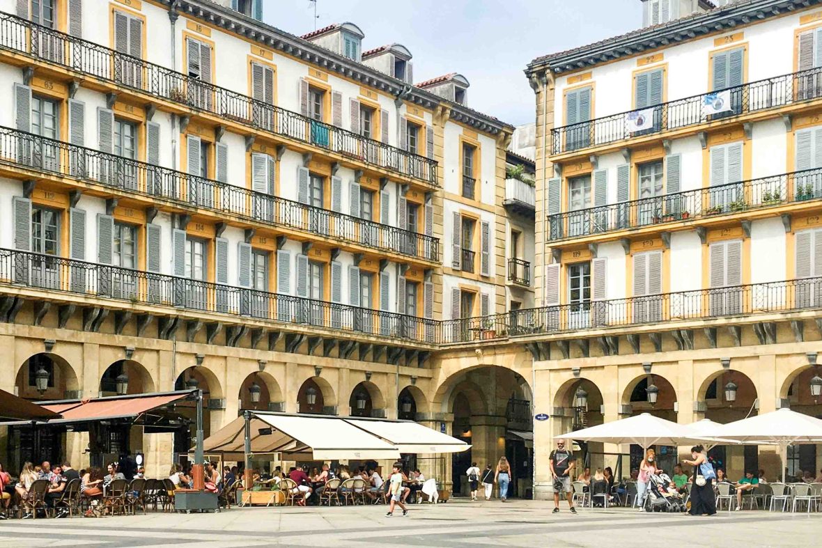 A plaza in San Sebastian lined with restaurants.