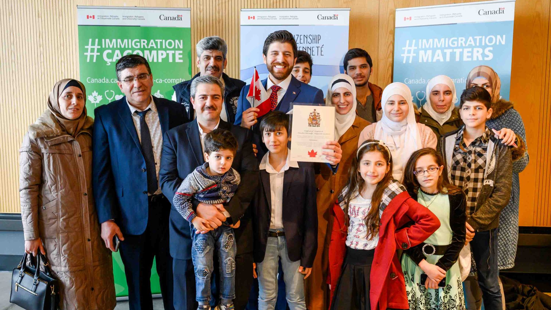 Tareq Hadhad, centre, poses with his family following his Canadian citizenship ceremony.
