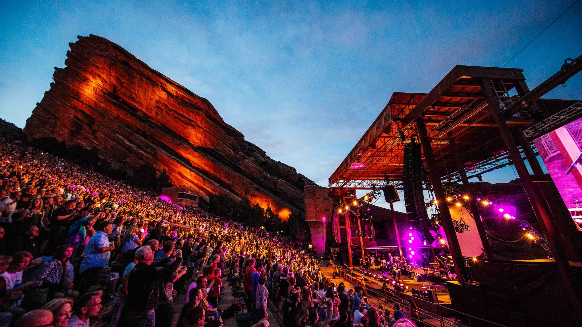 Red Rocks amphitheatre at night with a large audience.