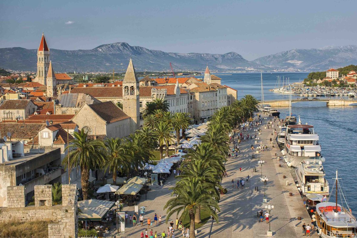Trogir, showing the road, buildings and sea.