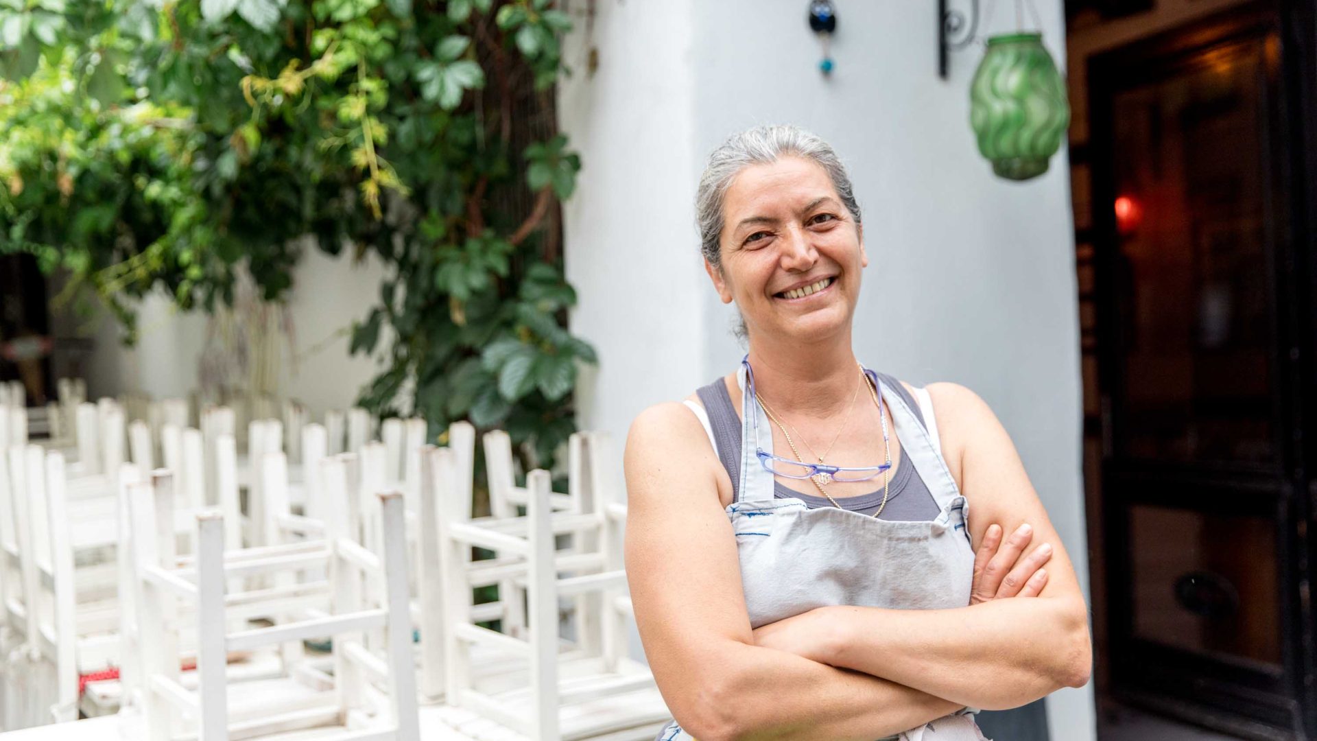 Yvalik, an owner of one of the lunch restaurants smiles with her arms crossed.