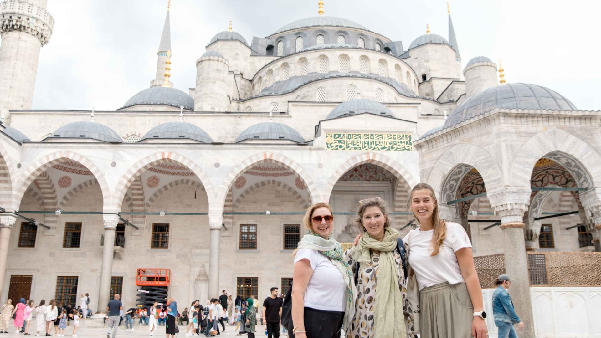 Travelers at the Blue Mosque, Turkey.