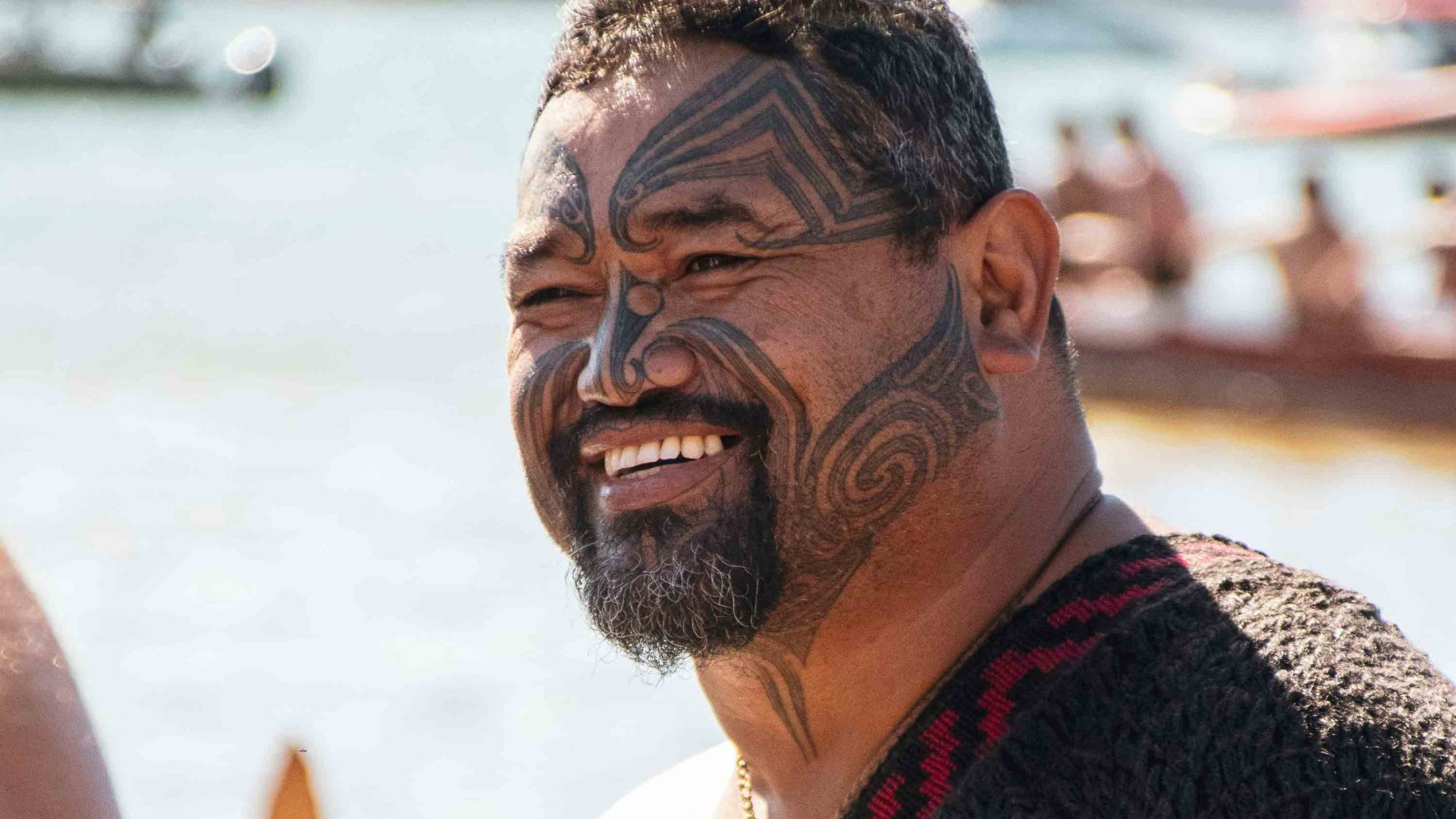 A Maori man with a tattooed face.