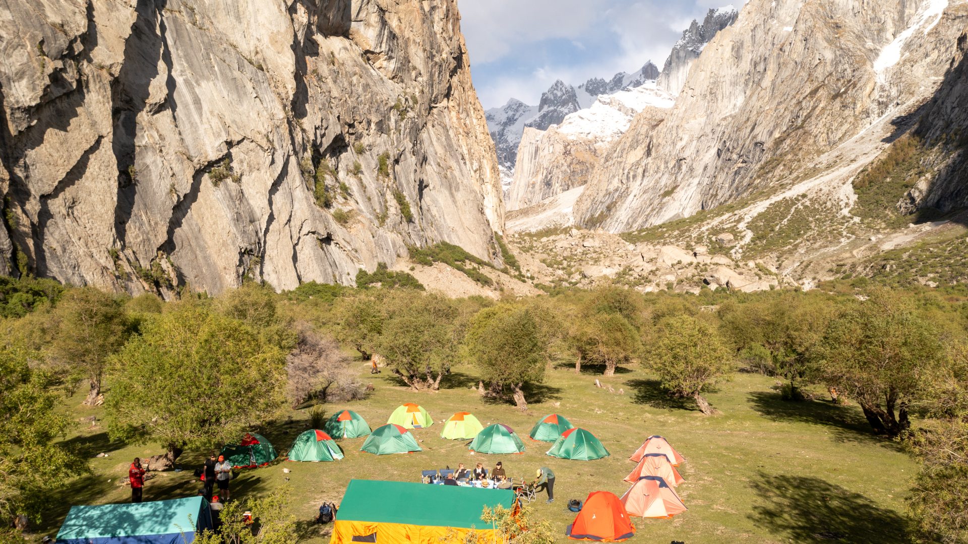 A campsite set up at the foot of the mountains