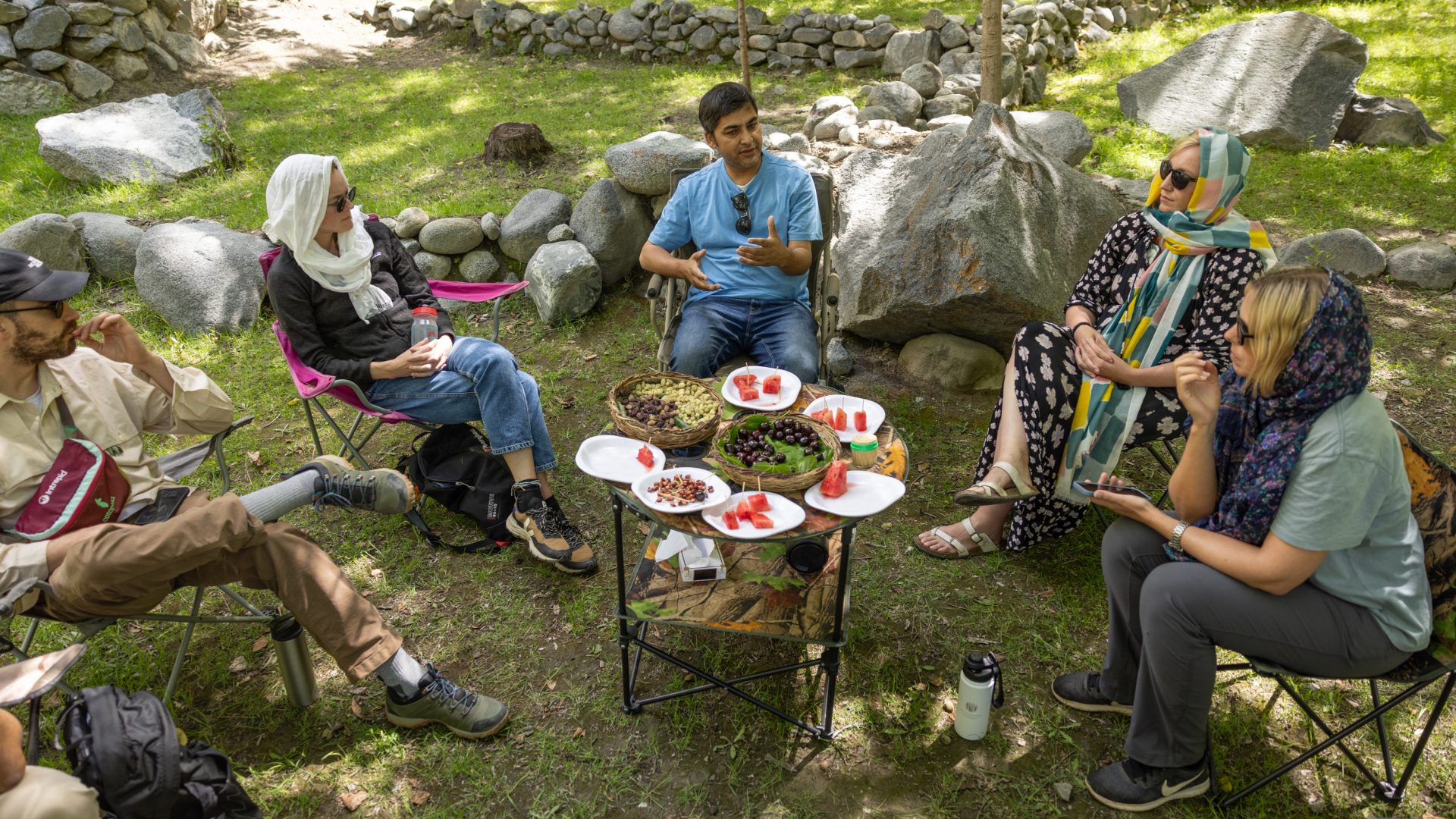 A group of travelers enjoy an al fresco lunch