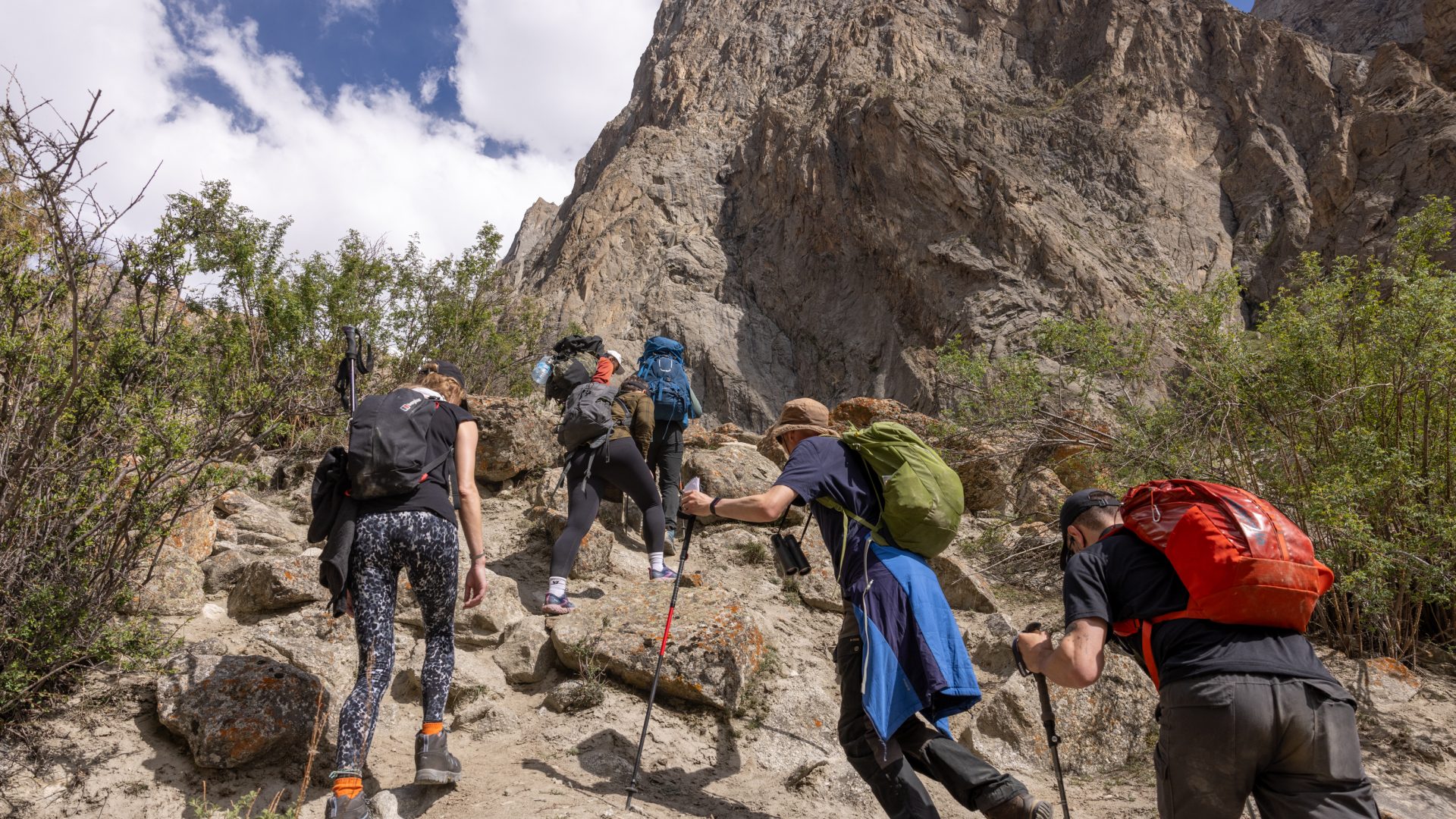 A group of hikers make their way across the mountains