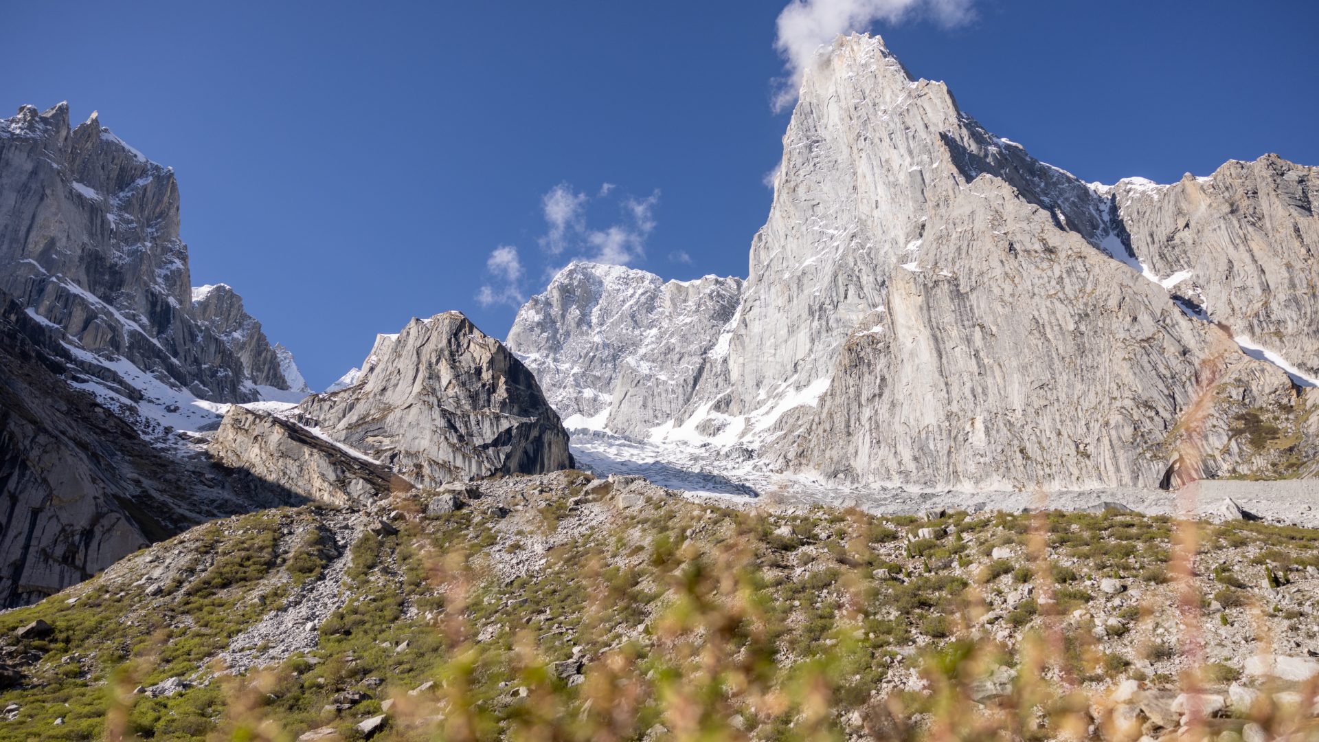 Soaring mountains against a blue sky.