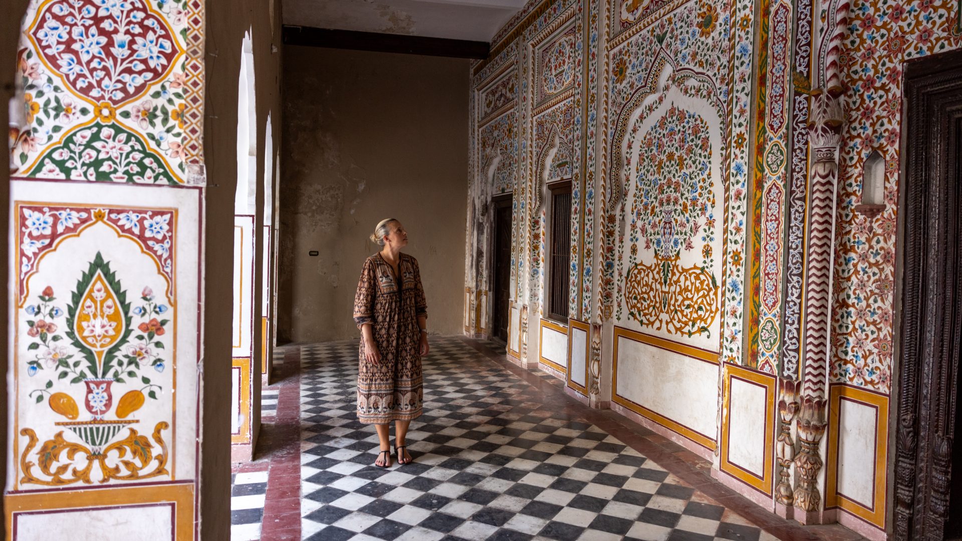 A traveler admires the ornate interior