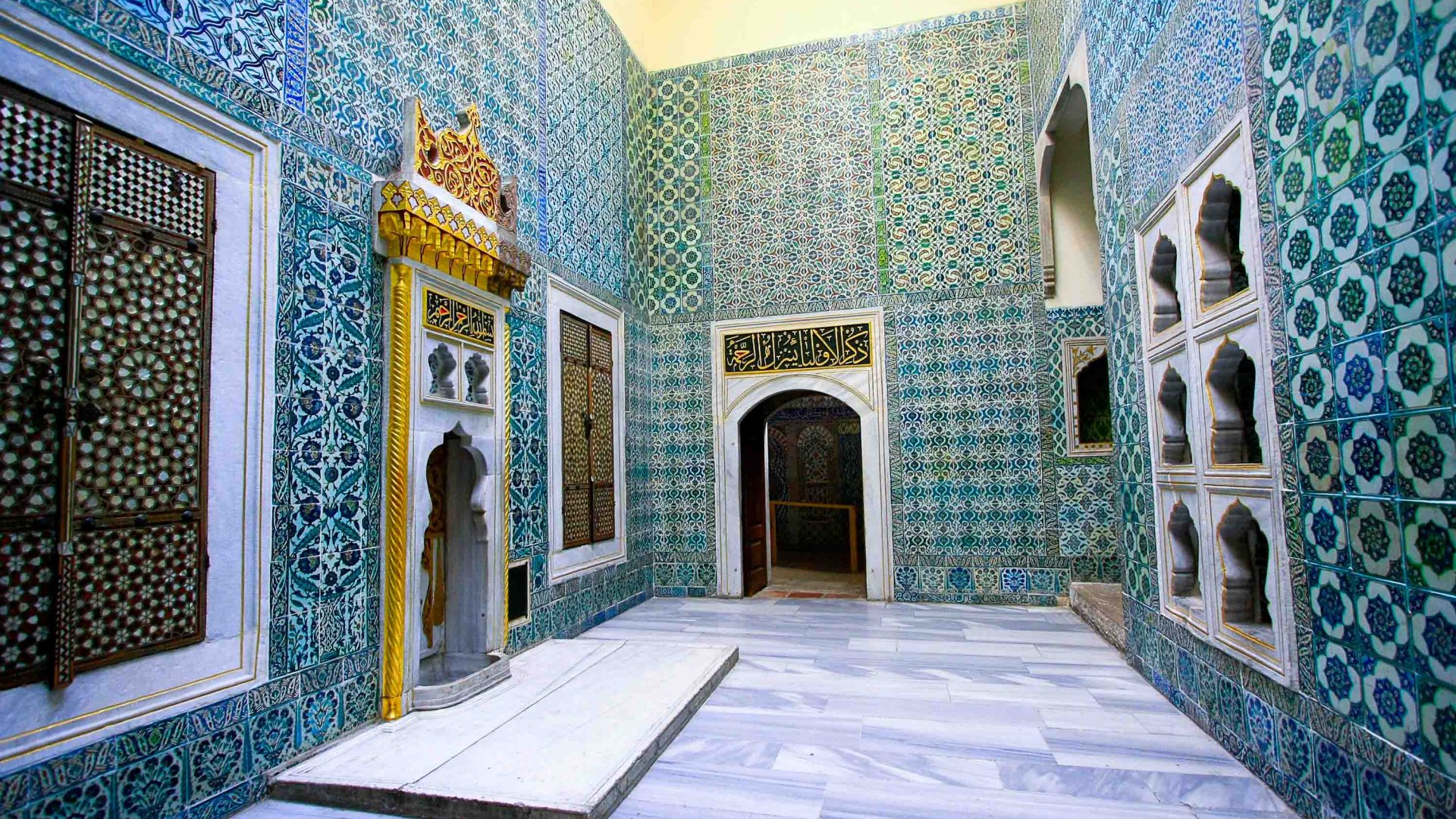 Blue and yellow decorative tiles on the interior of a hammam.