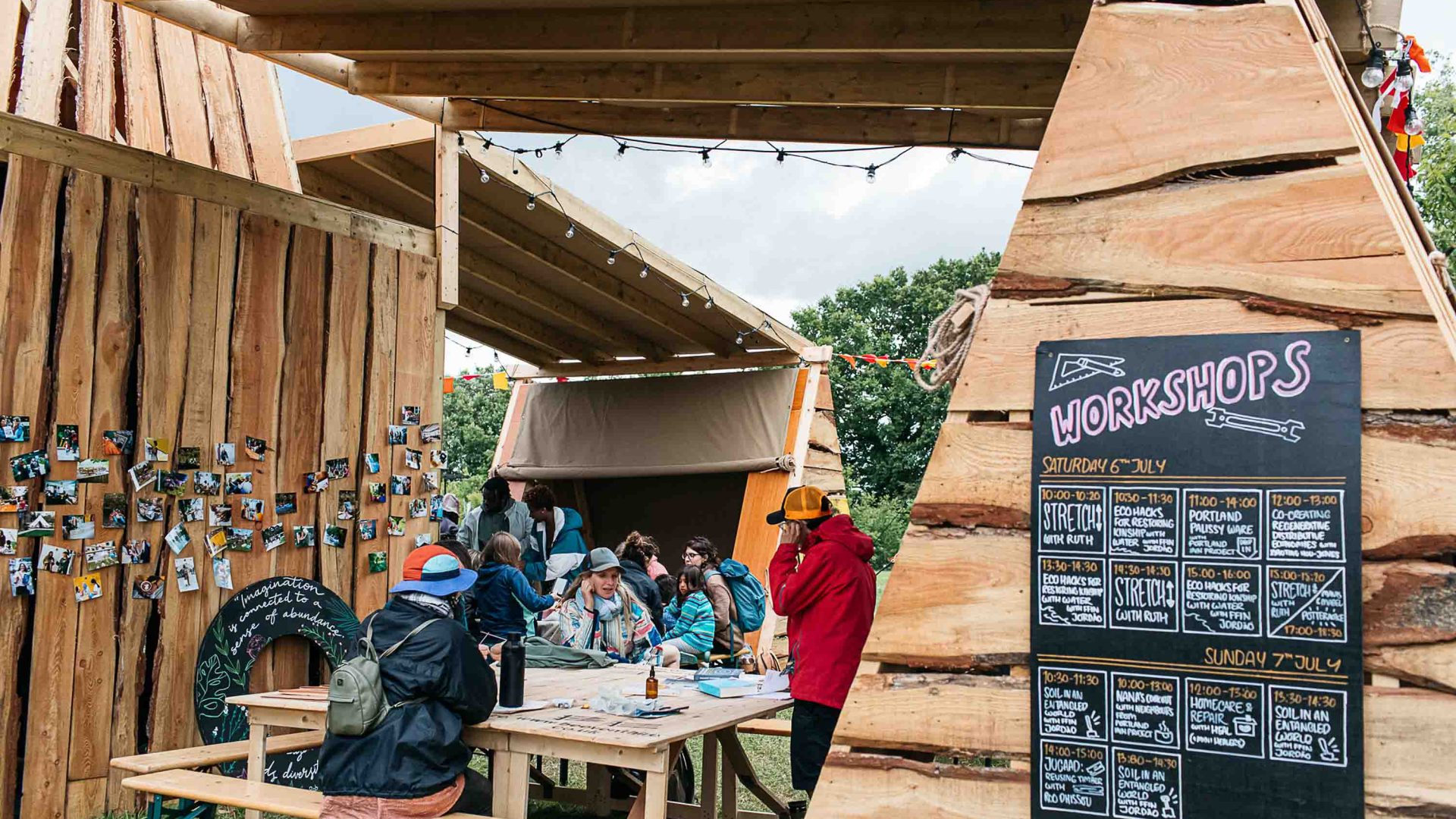 Festival goers at a workshop area.