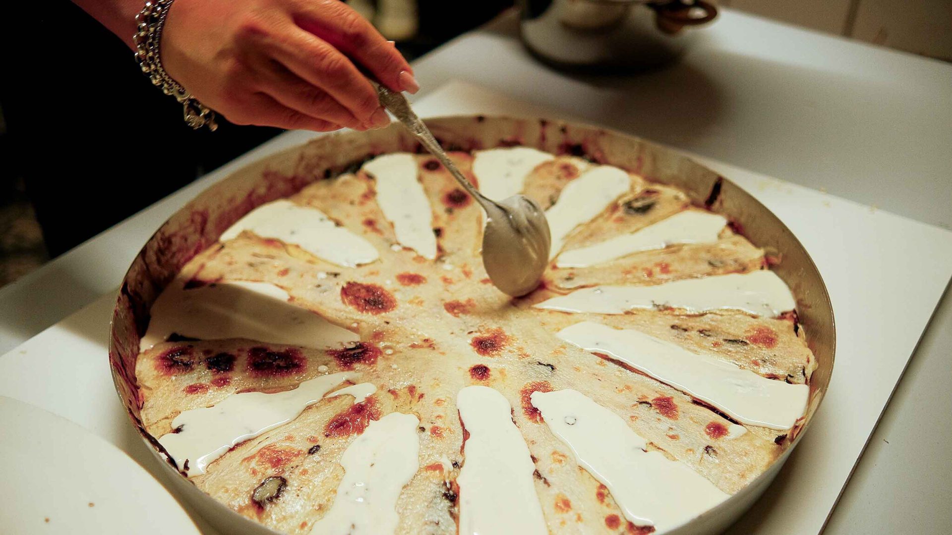 A person serves up traditional flia.