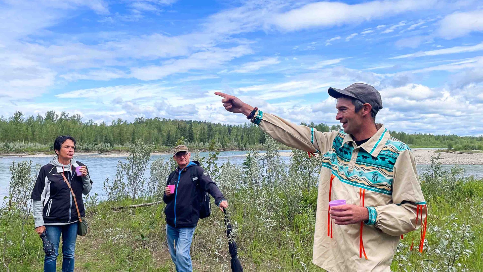 A man talks and points to a group.