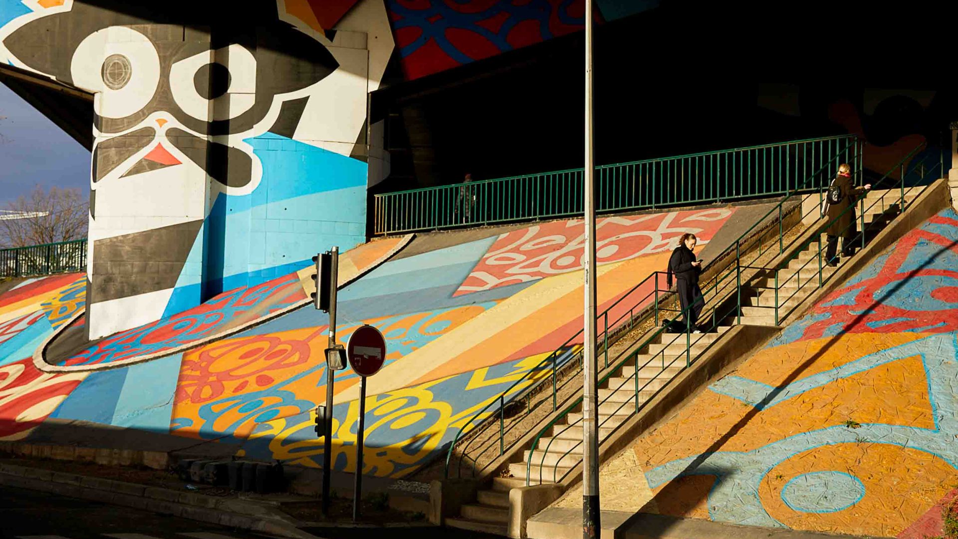 Vibrant street art along steps and walkways in town.