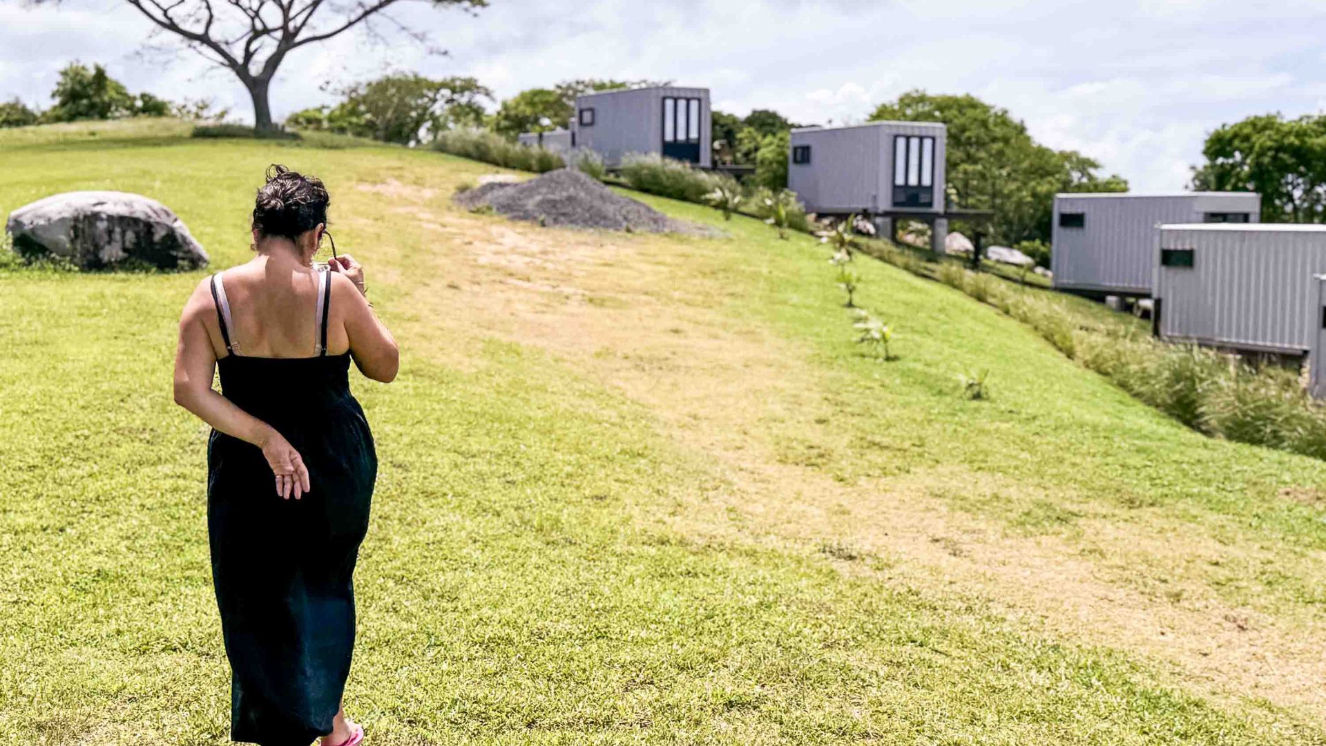 A woman walks across the grounds of Lejos Eco Retreat in Puerto Rico.