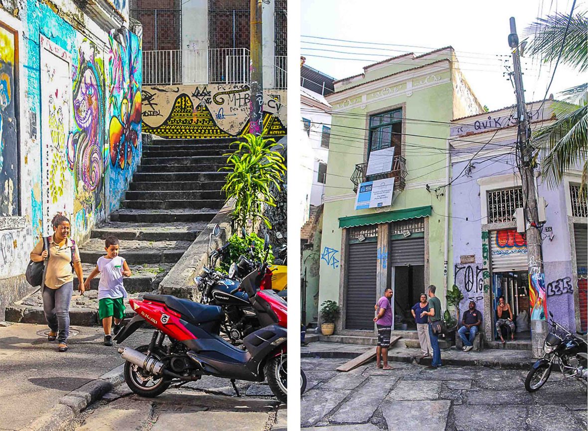 People in the street, with staircases, buildings and street art.