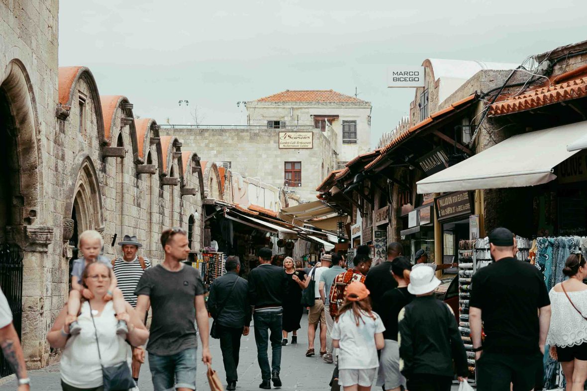 Tourists shop for souvenirs at a market.