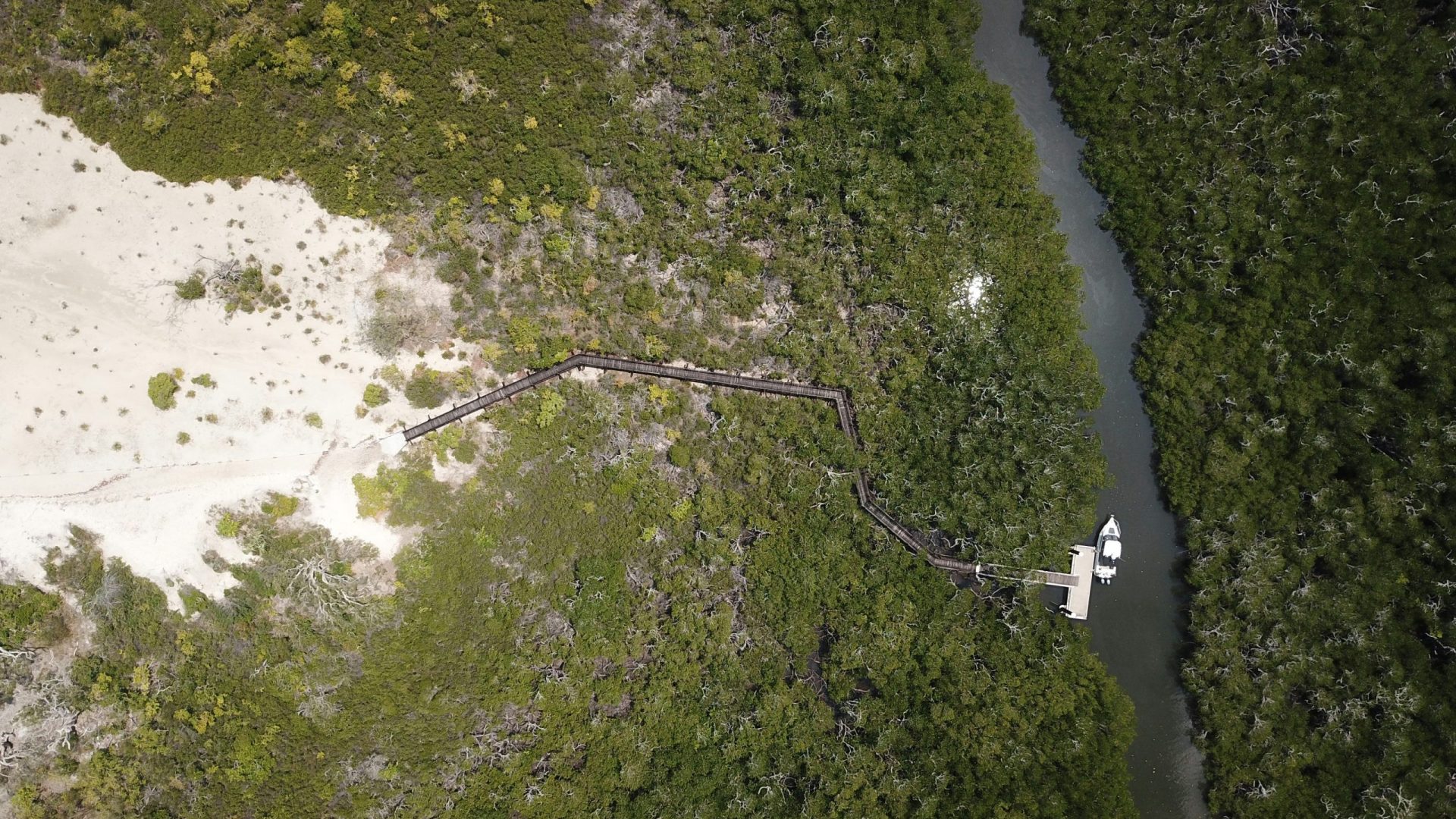 a boat docks at an island estuary