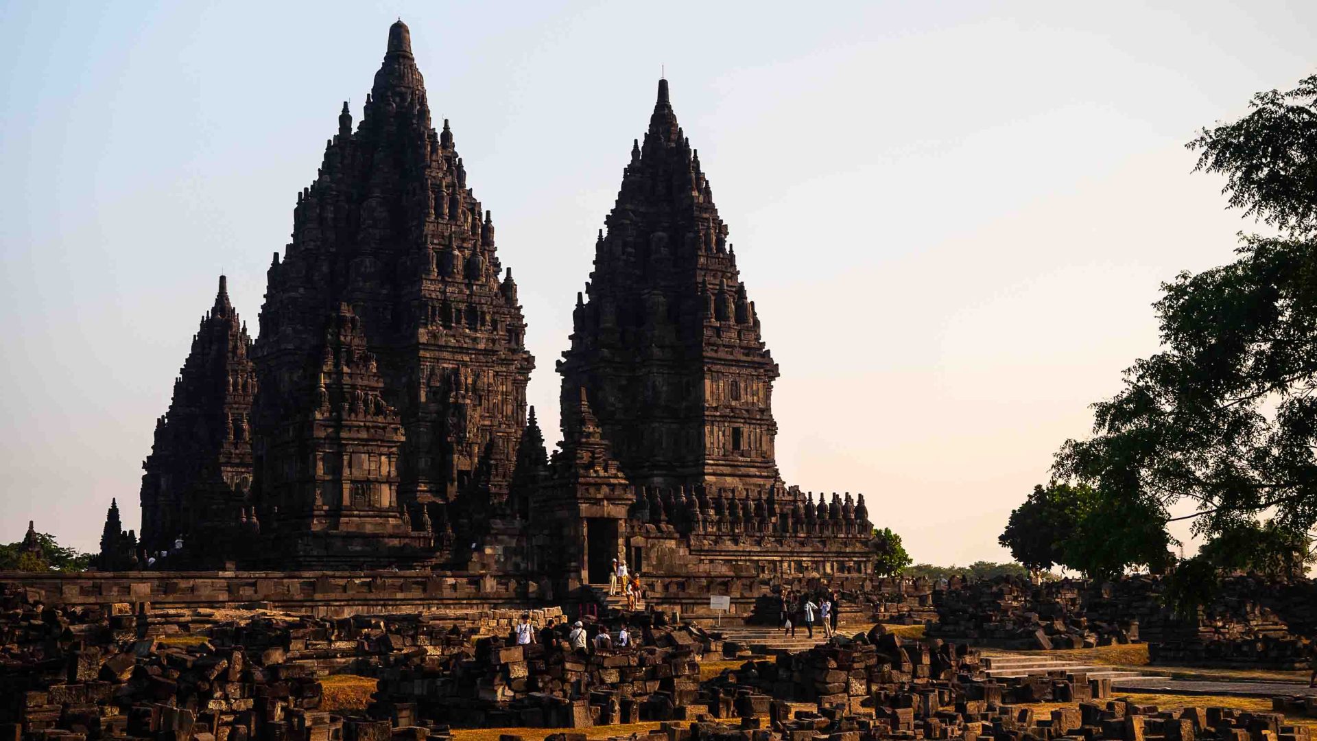 Visitors are dwarfed by the height of Prambanan Temple.