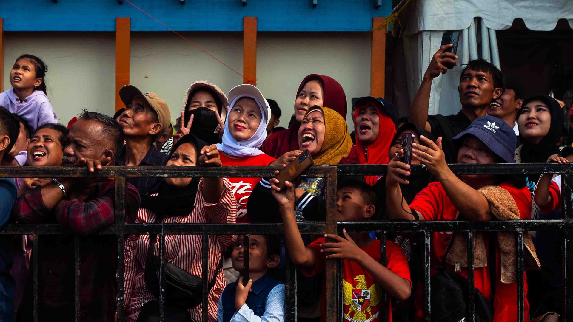 Excited looking crowds watch Independence Day games