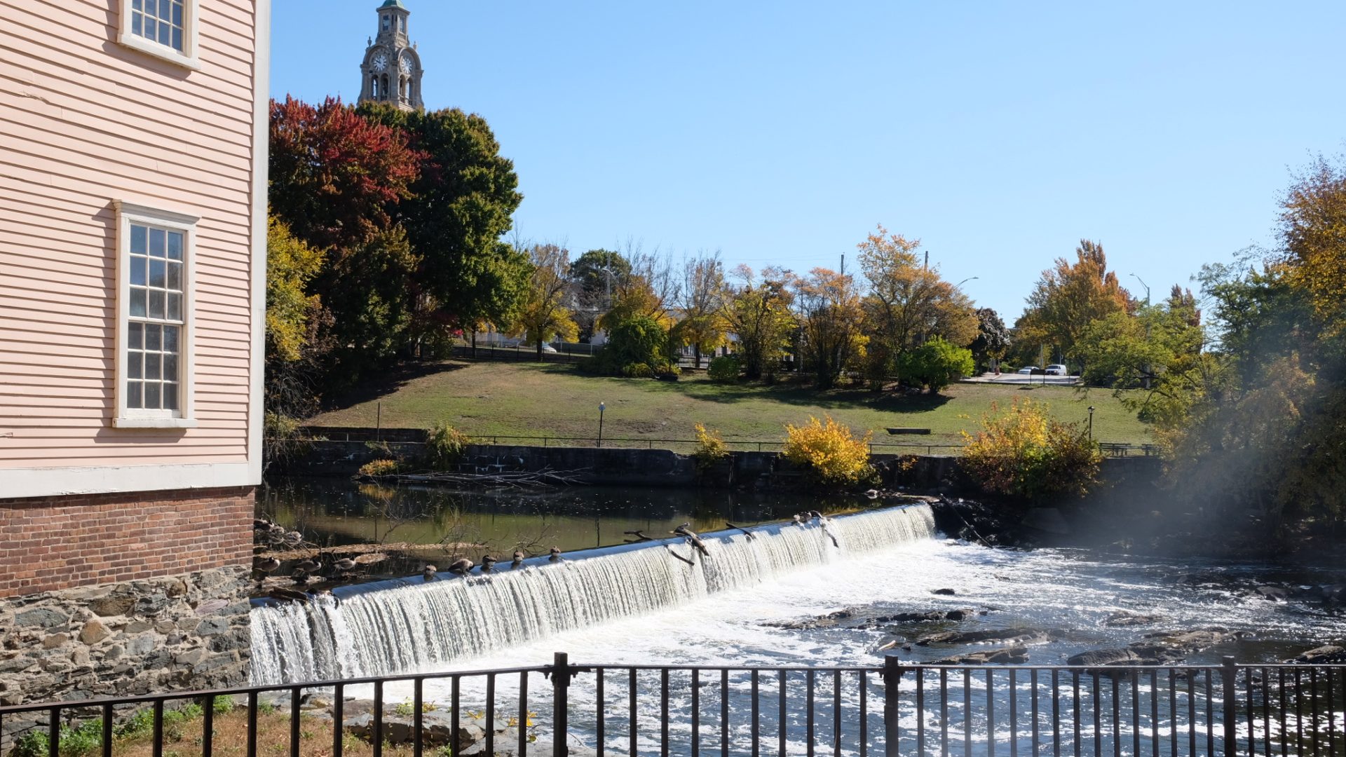 A view across the Blackstone River in Pawtucket, Rhode Island, with Slater Mill to the left.