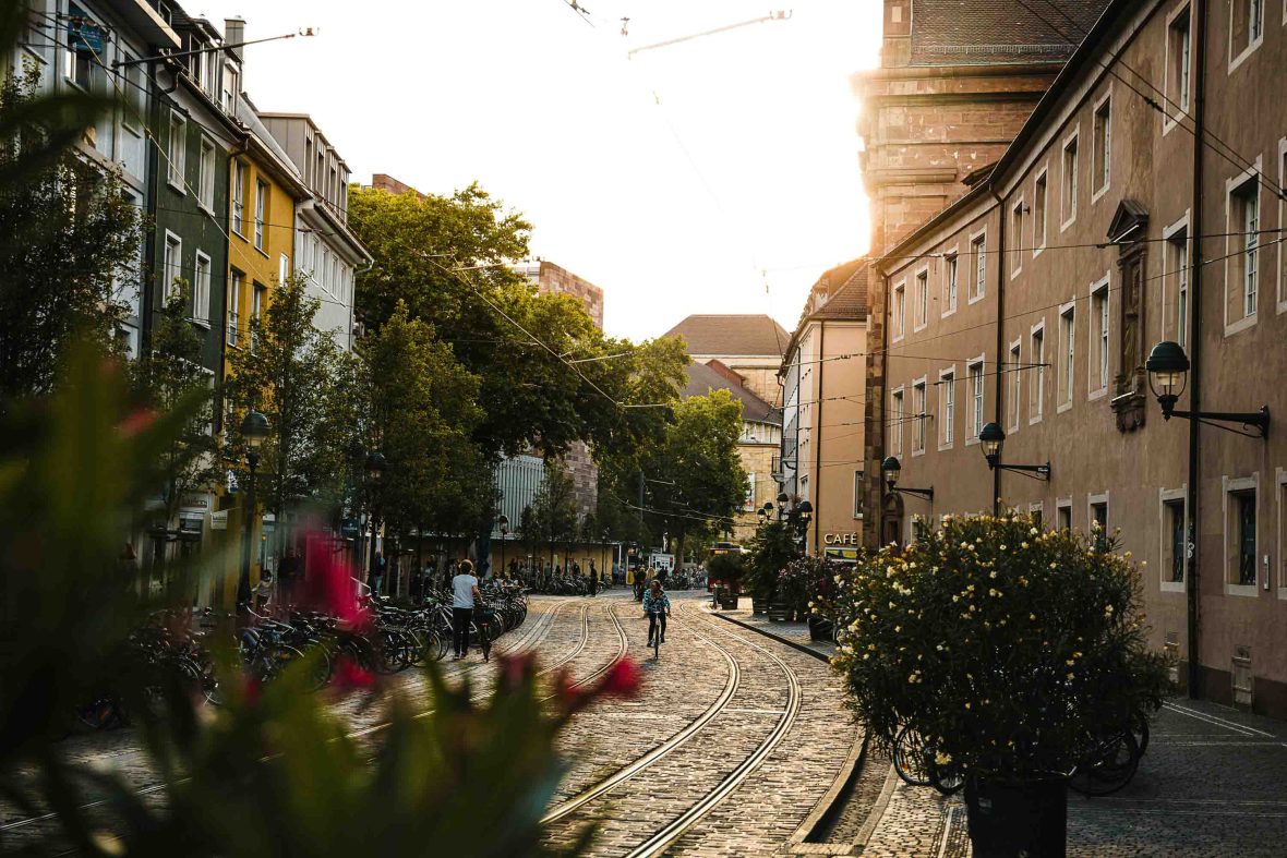 Soft light falls on the cobbled streets.