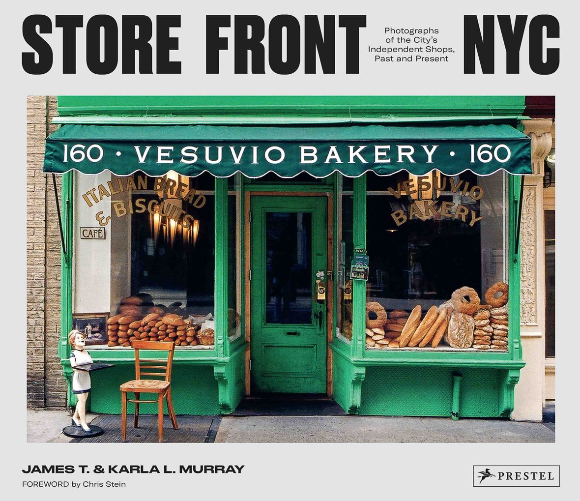 The book cover with black and white font and a green store front.