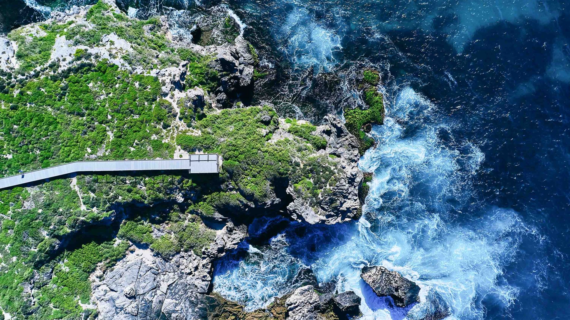 Aerial shot of the boardwalk and coastline.