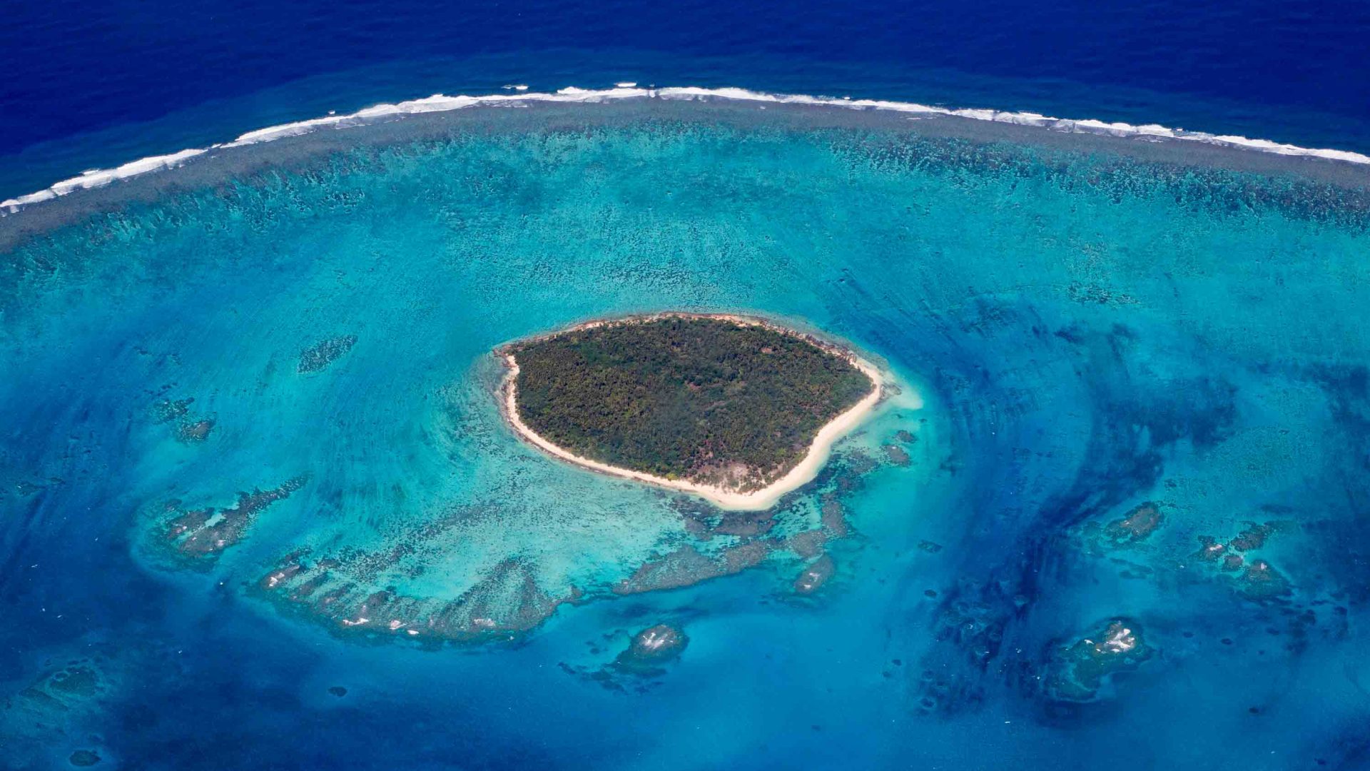 A small island surrounded by reef.