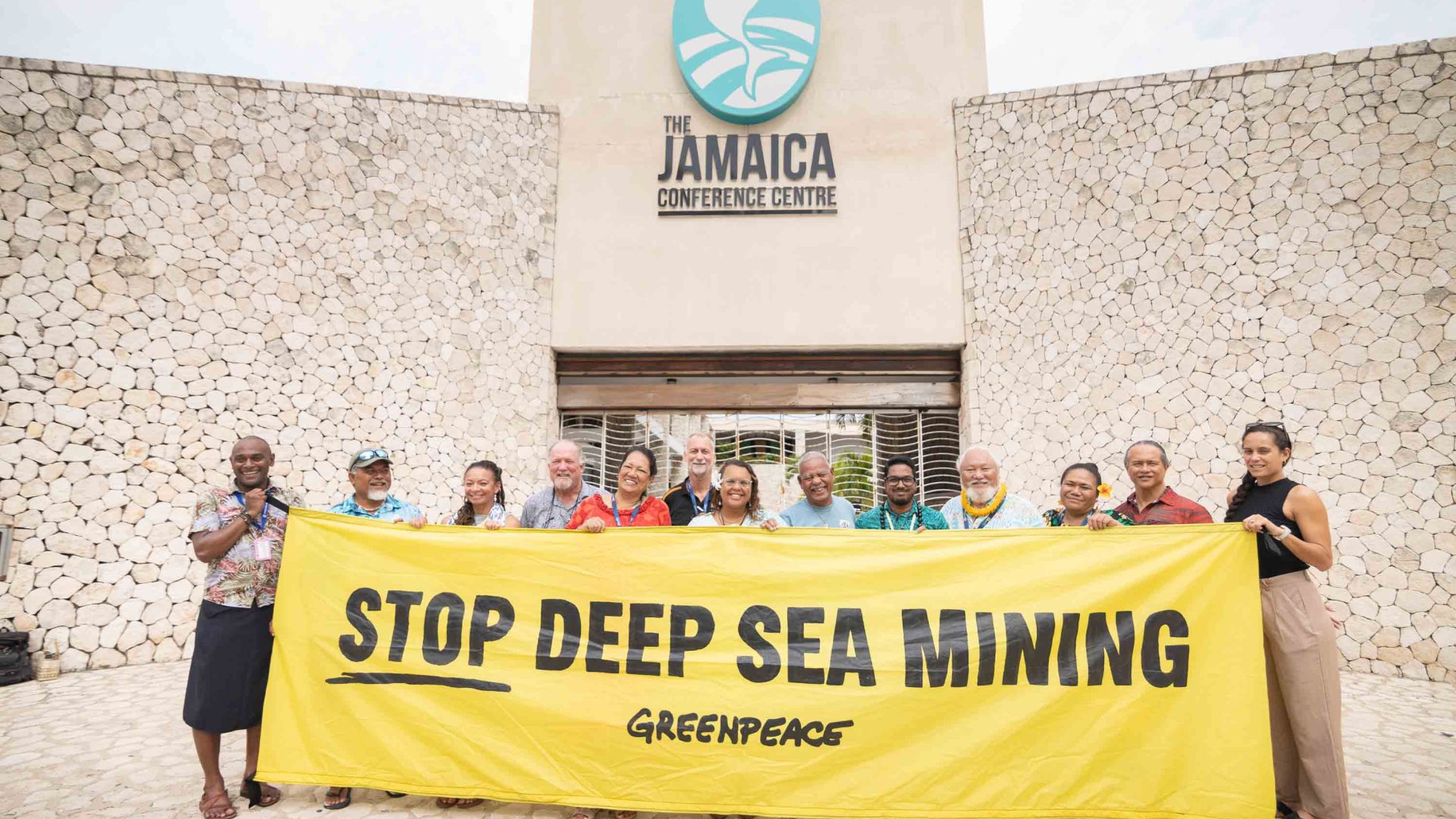 Pacific Leaders hold banner outside ISA Conference Centre in Kingston, Jamaica.