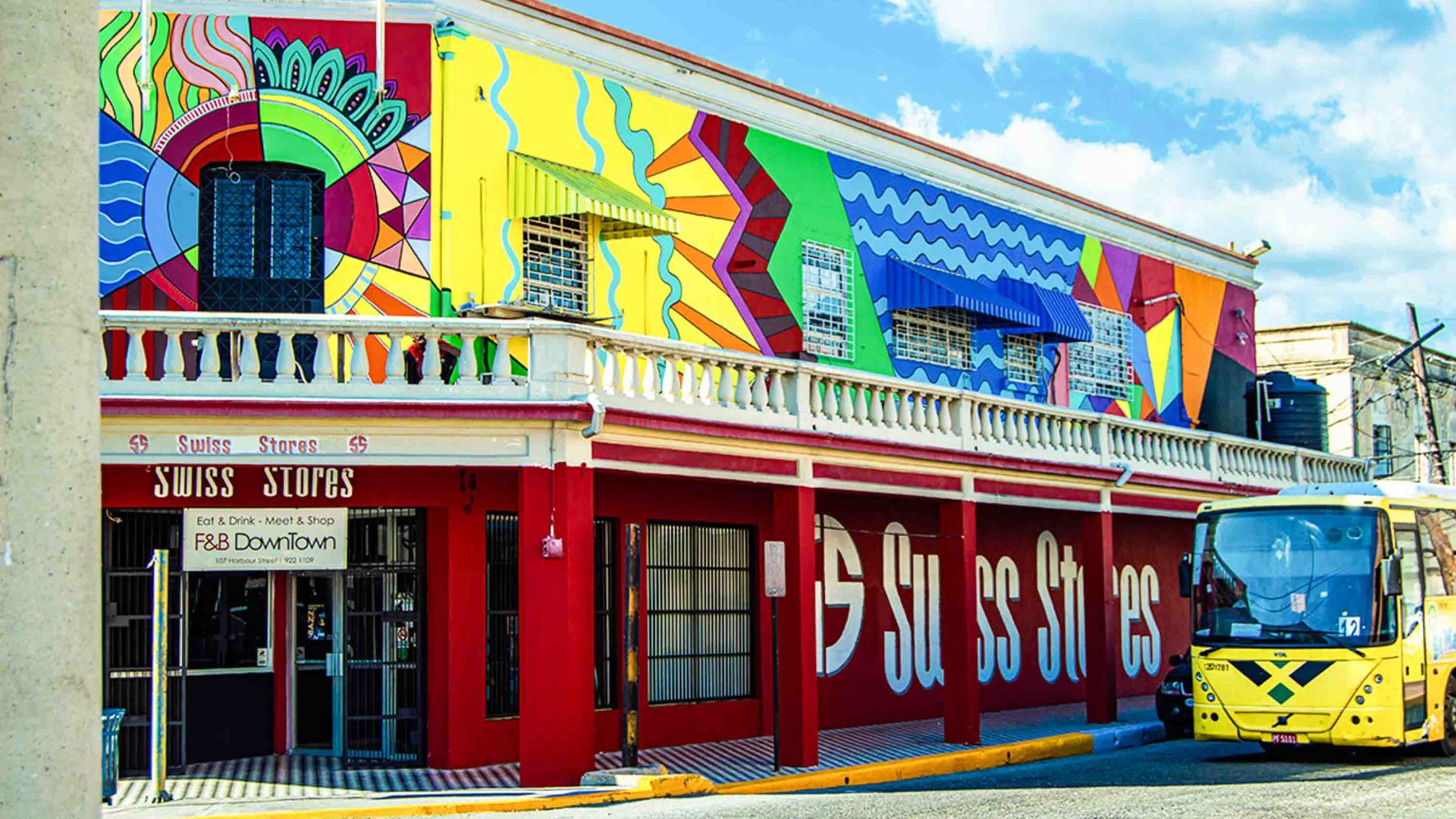 A colorful mural adorns a storefront.