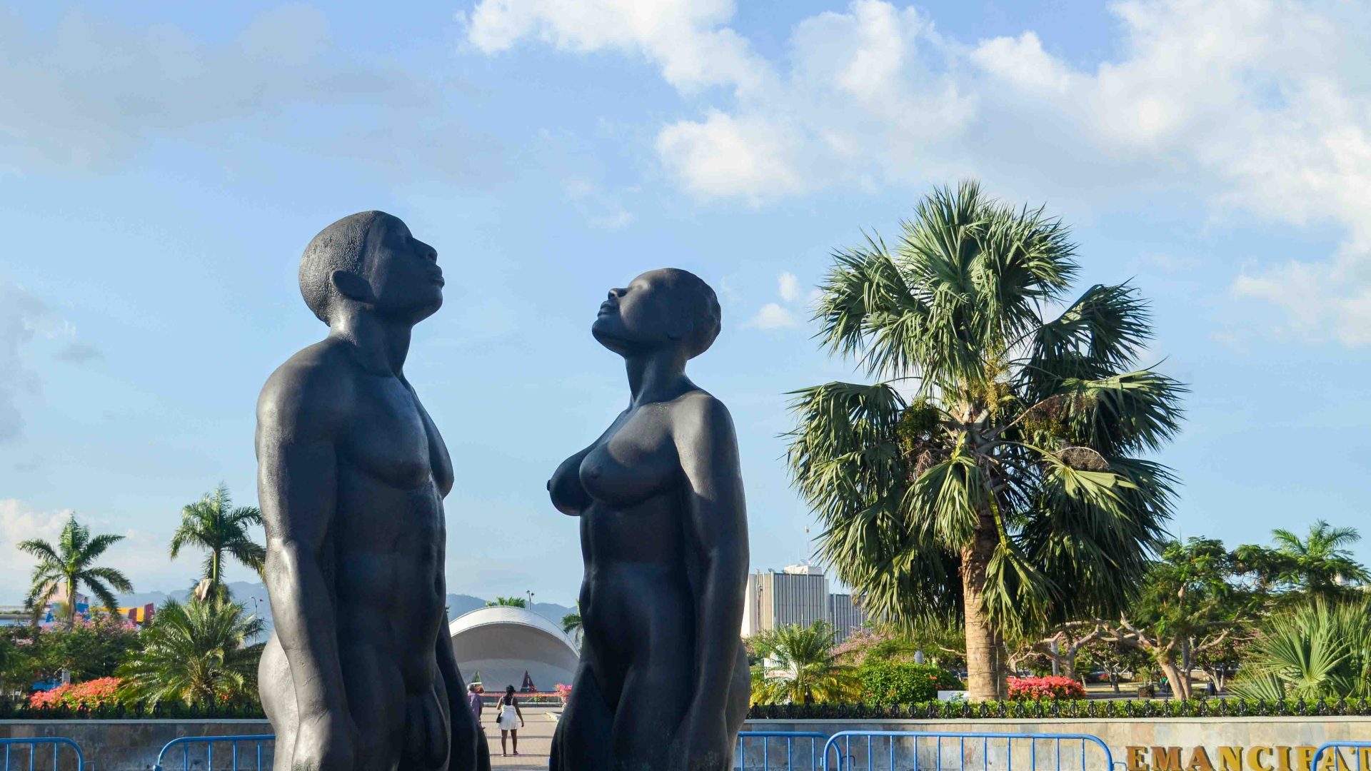 A bronze statue of a man and a woman looking up to the sky.